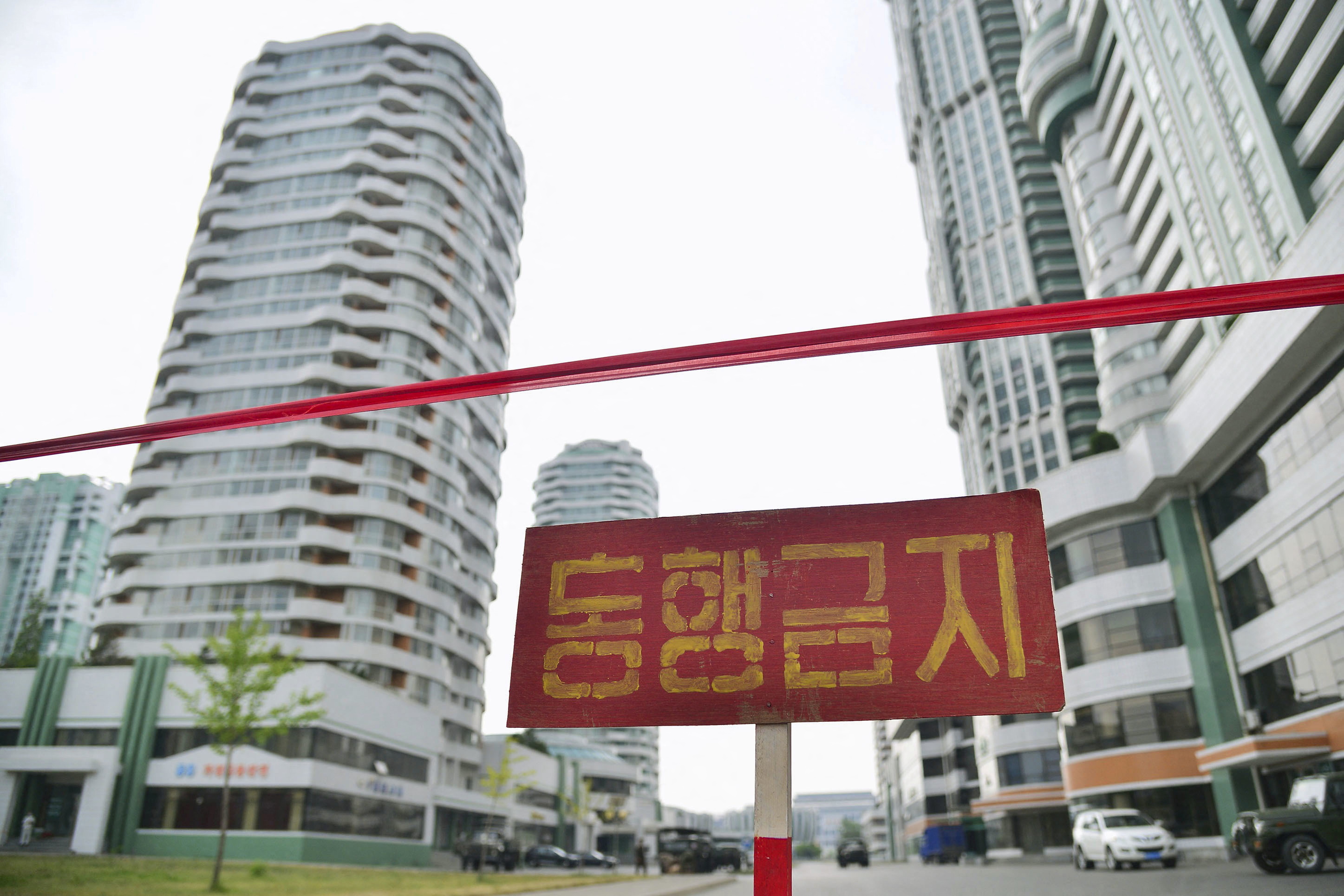 FILE PHOTO - Sign is seen on closed street amid fears over COVID-19, in Pyongyang