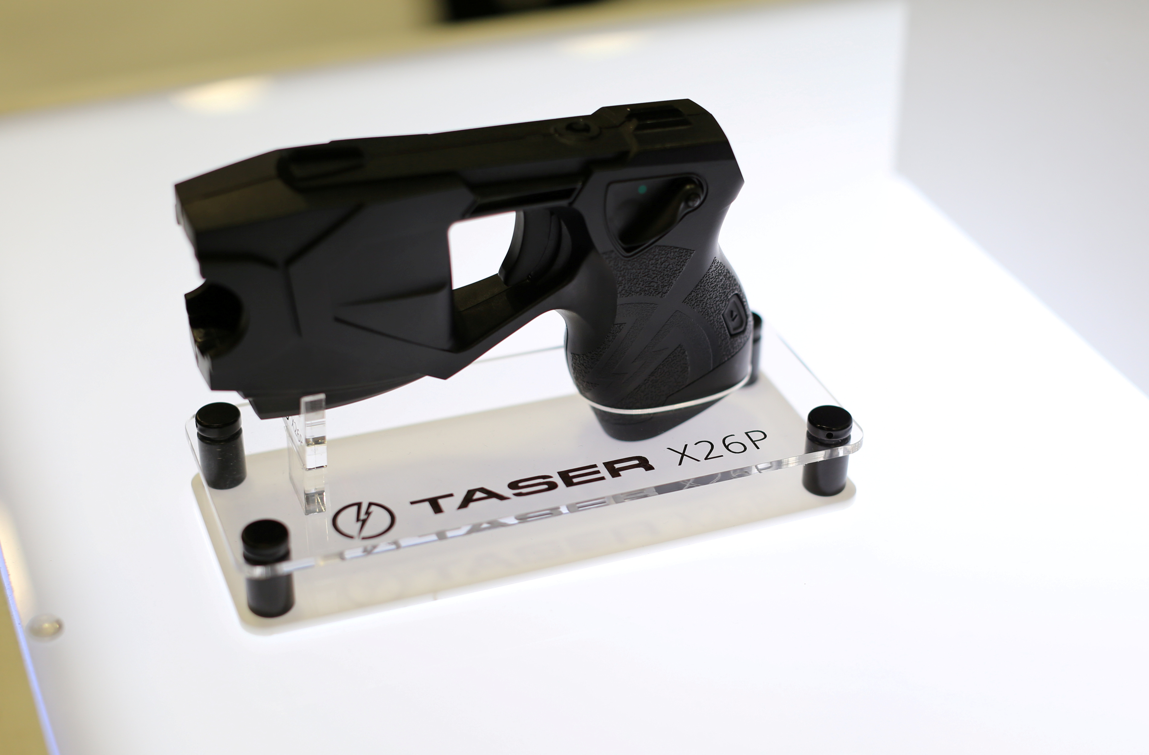 An X26P Taser gun is shown on display at the Taser booth during the International Association of Chiefs of Police conference in San Diego