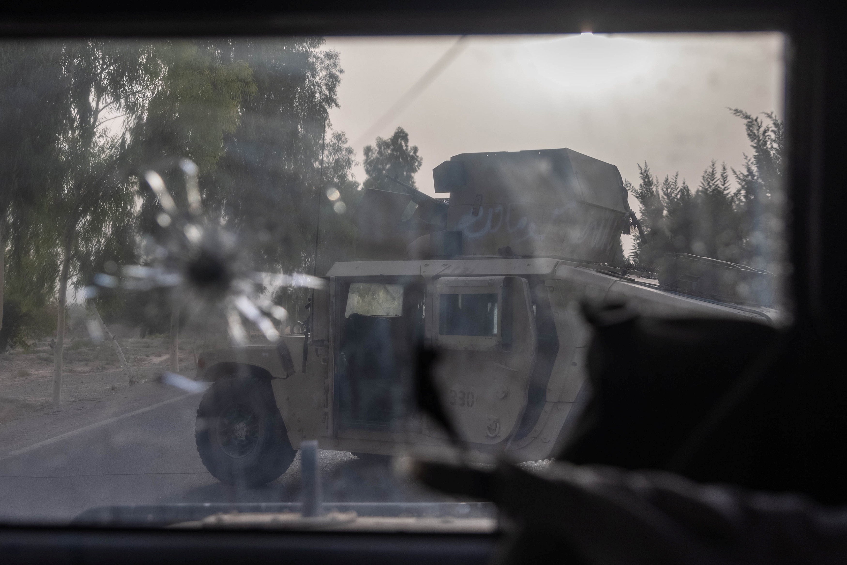 A humvee belonging Afghan Special Forces is seen destroyed during heavy clashes with Taliban during the rescue mission of a police officer besieged at a check post, in Kandahar province