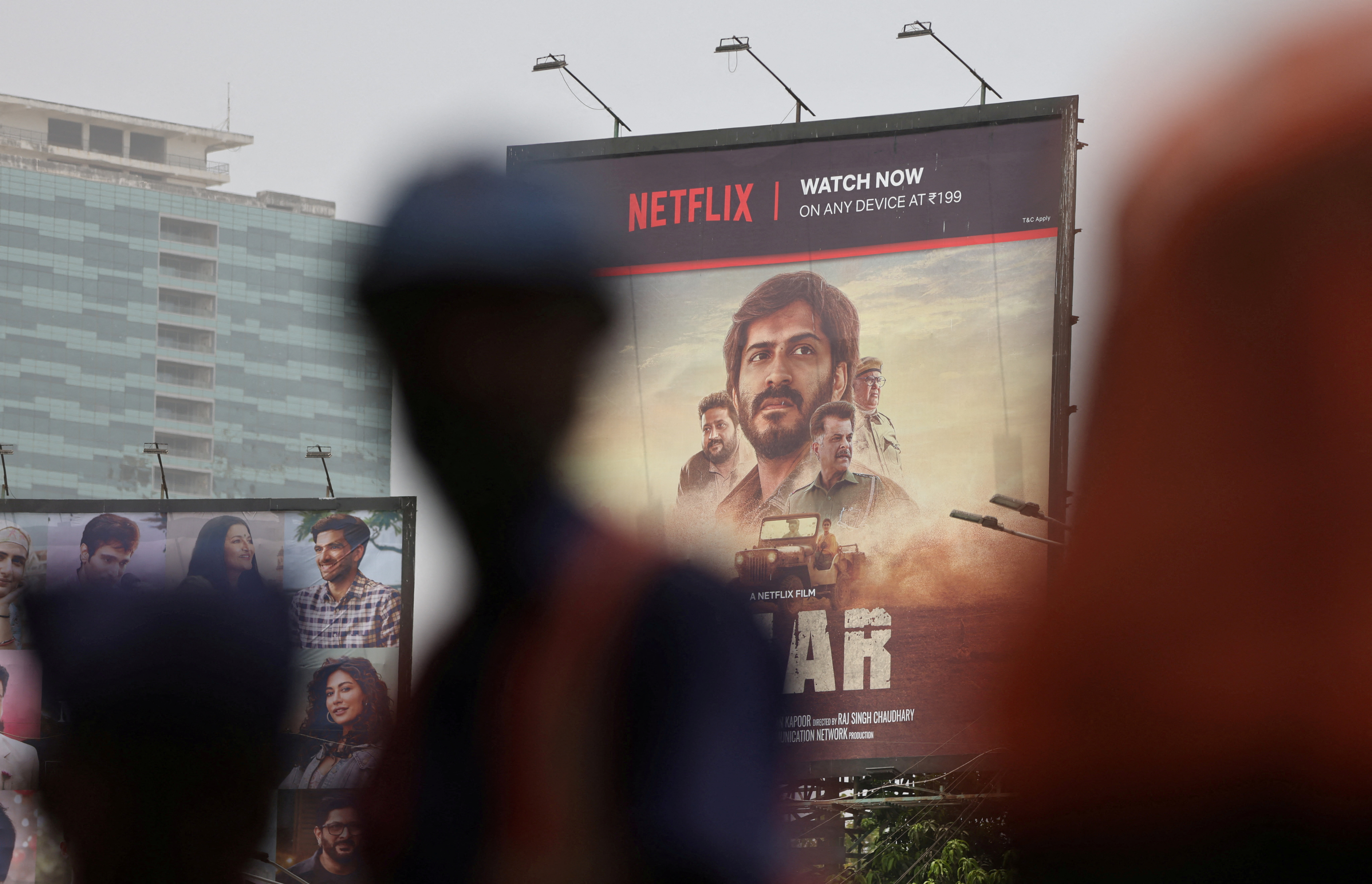 Billboard for Netflix movie "Thar" is seen on a street in Mumbai