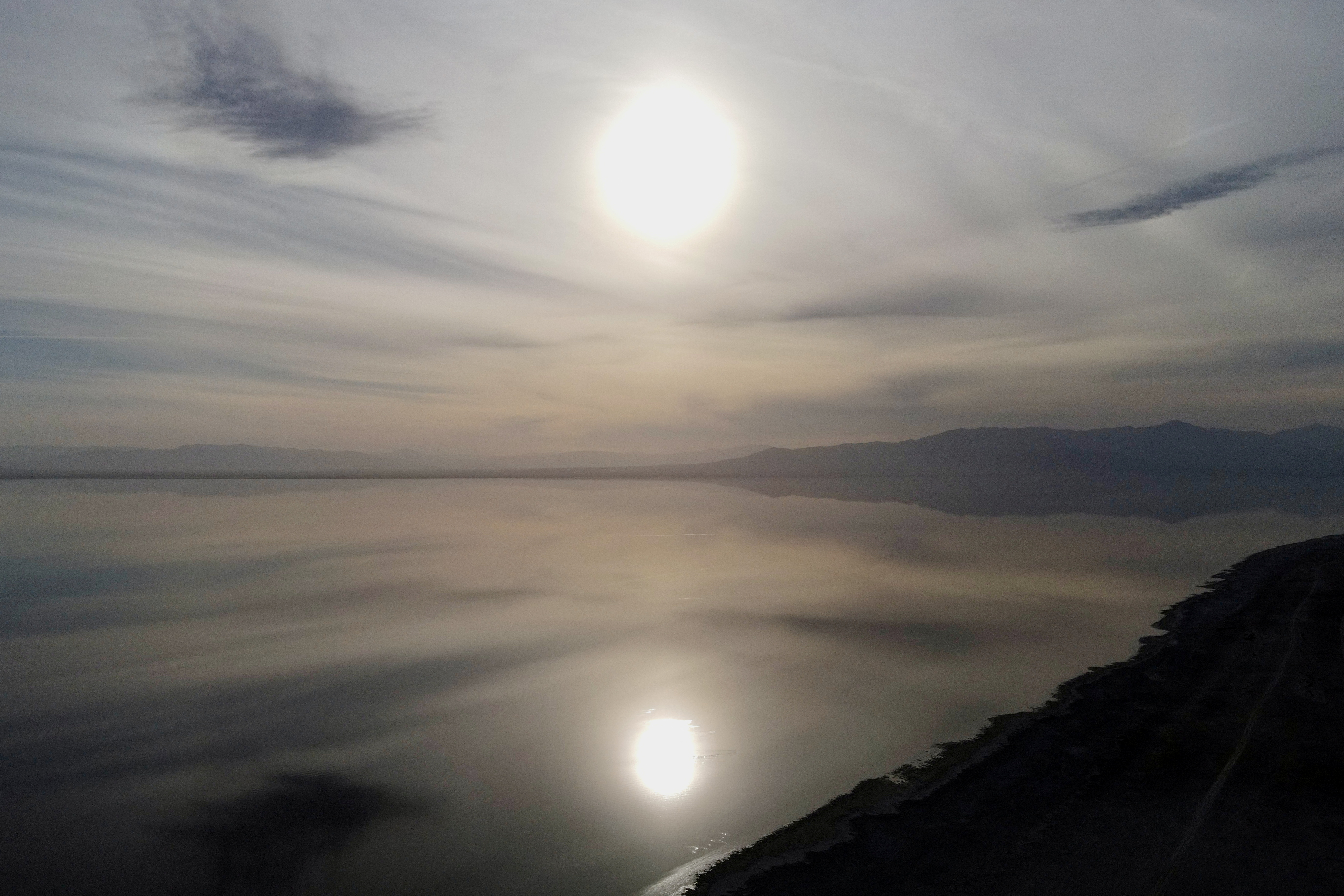 Sunset is reflected in the Salton Sea as seen from Bombay Beach