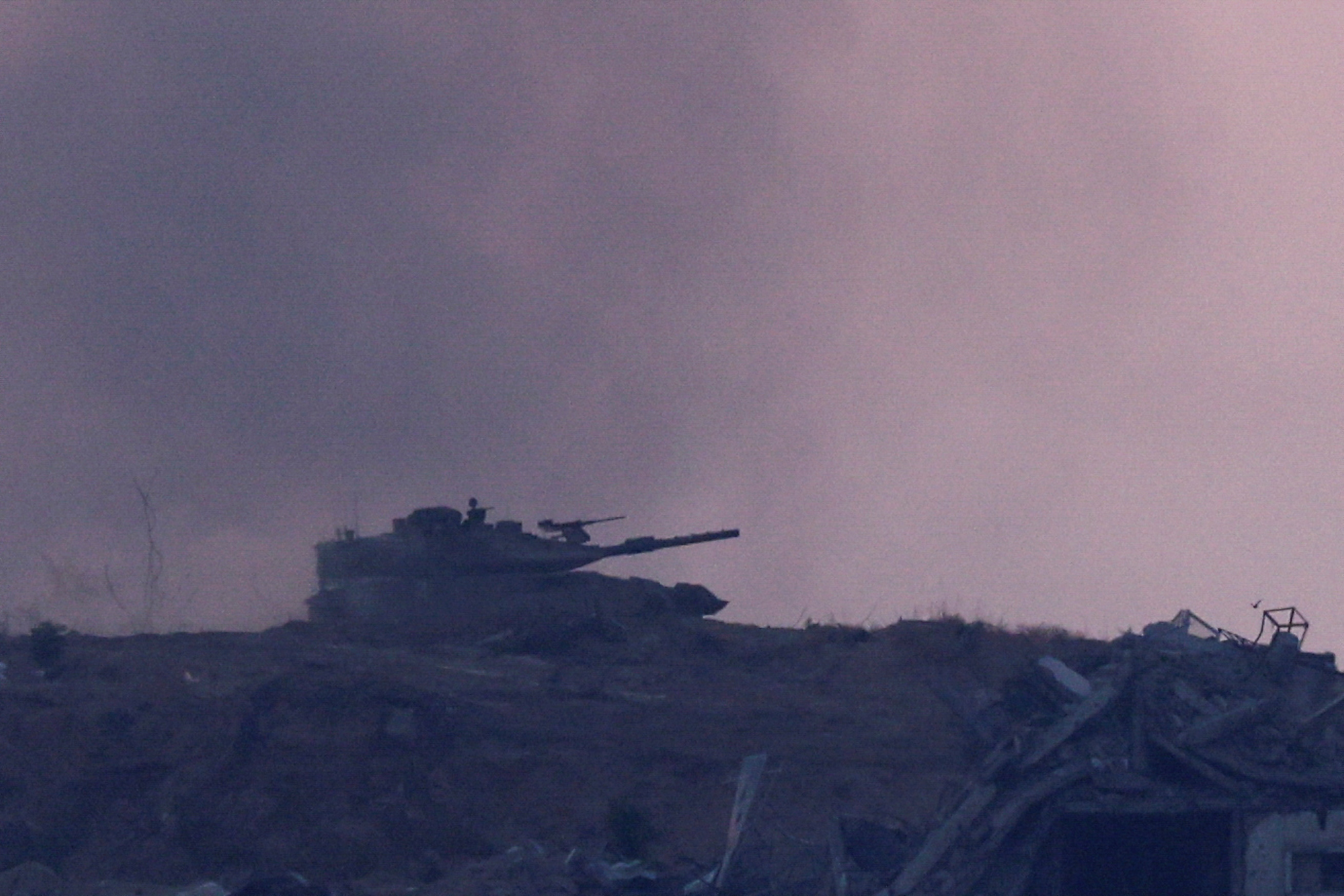 Israeli tanks manoeuvre near the Gaza-Israel border, in Israel