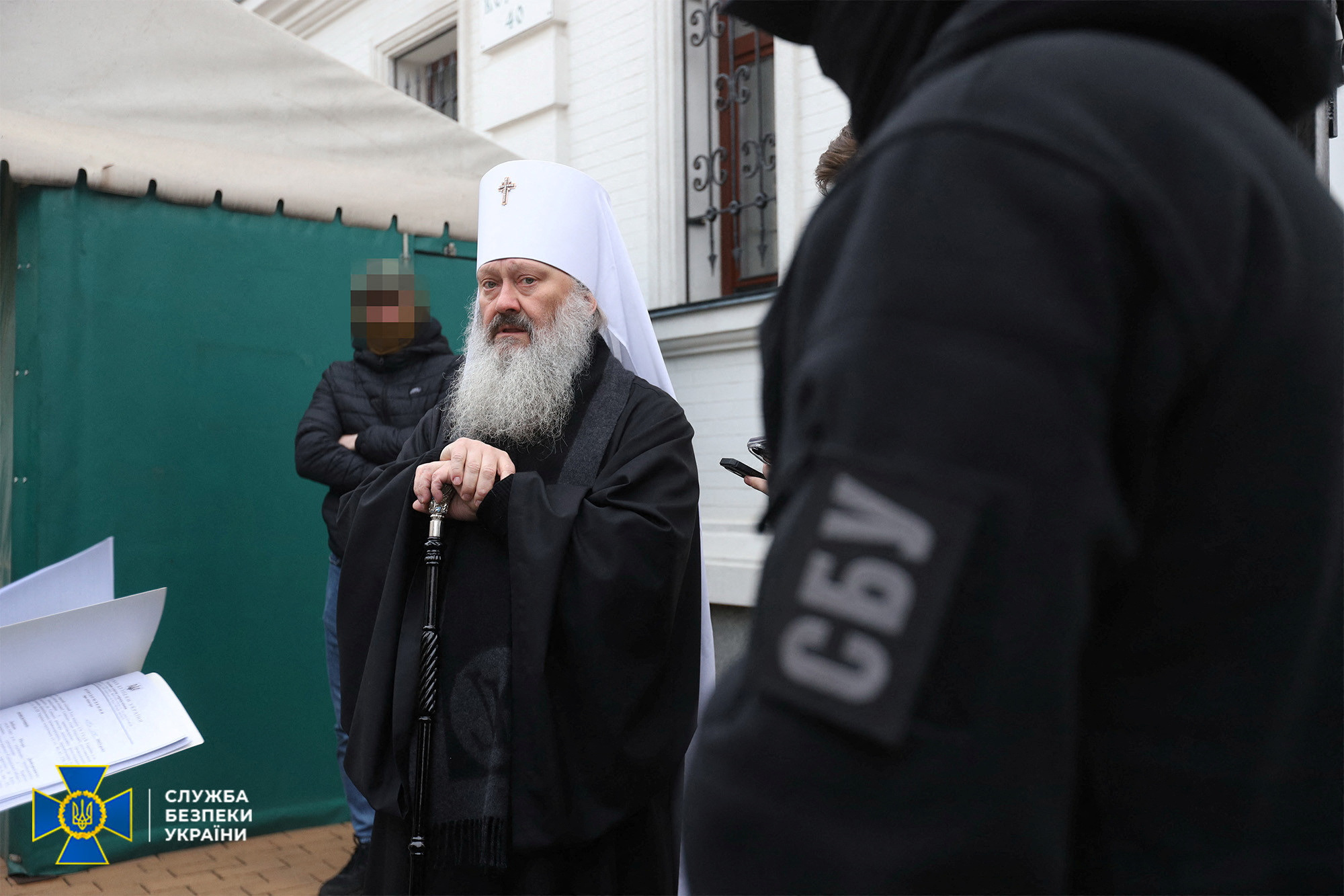 Metropolitan Pavlo of the Ukrainian Orthodox Church, accused of being linked to Moscow, receives an accusation letter from members of the State Security Service in Kyiv