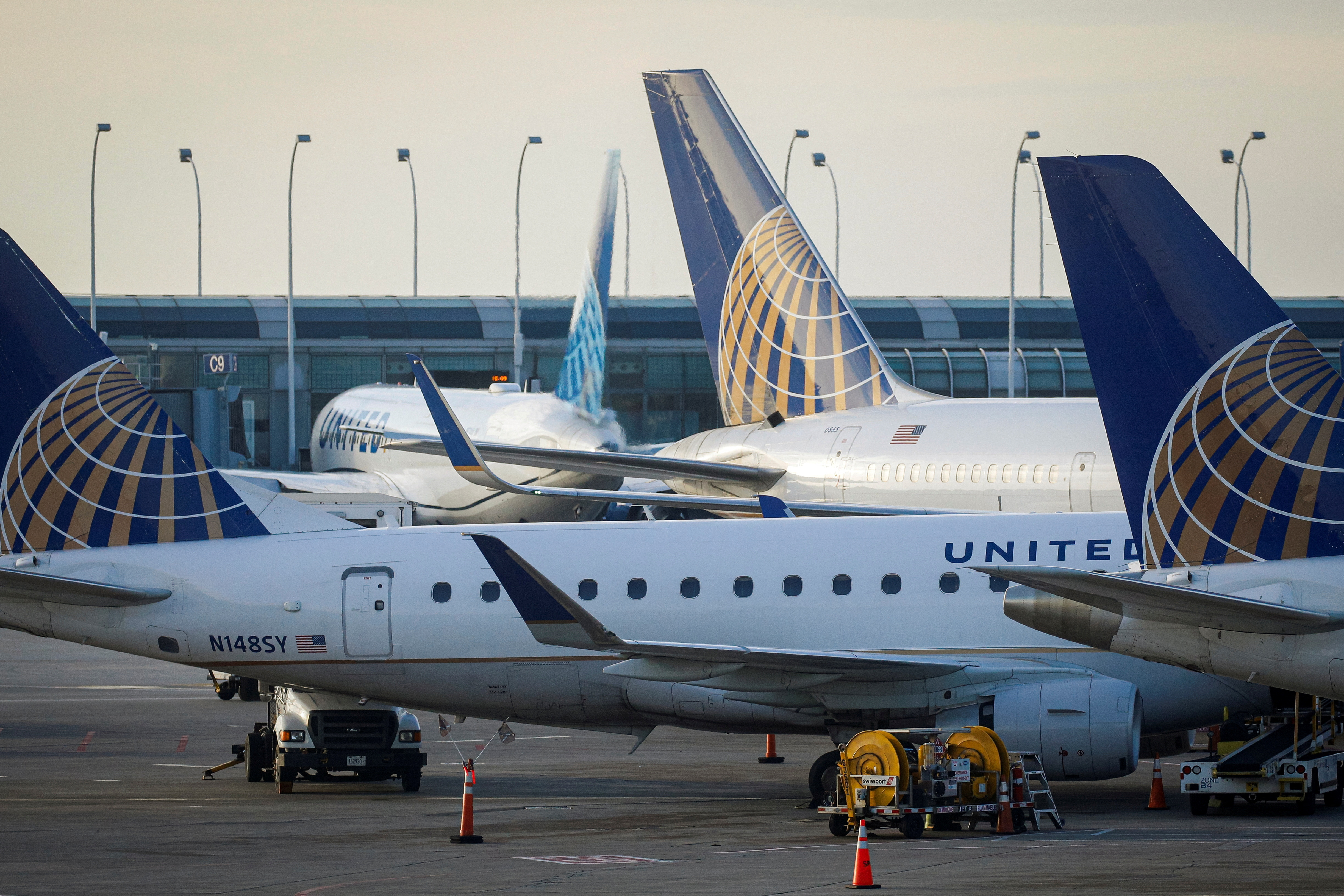United Airlines planes are parked at their gates at O'Hare International Airport in Chicago, Illinois