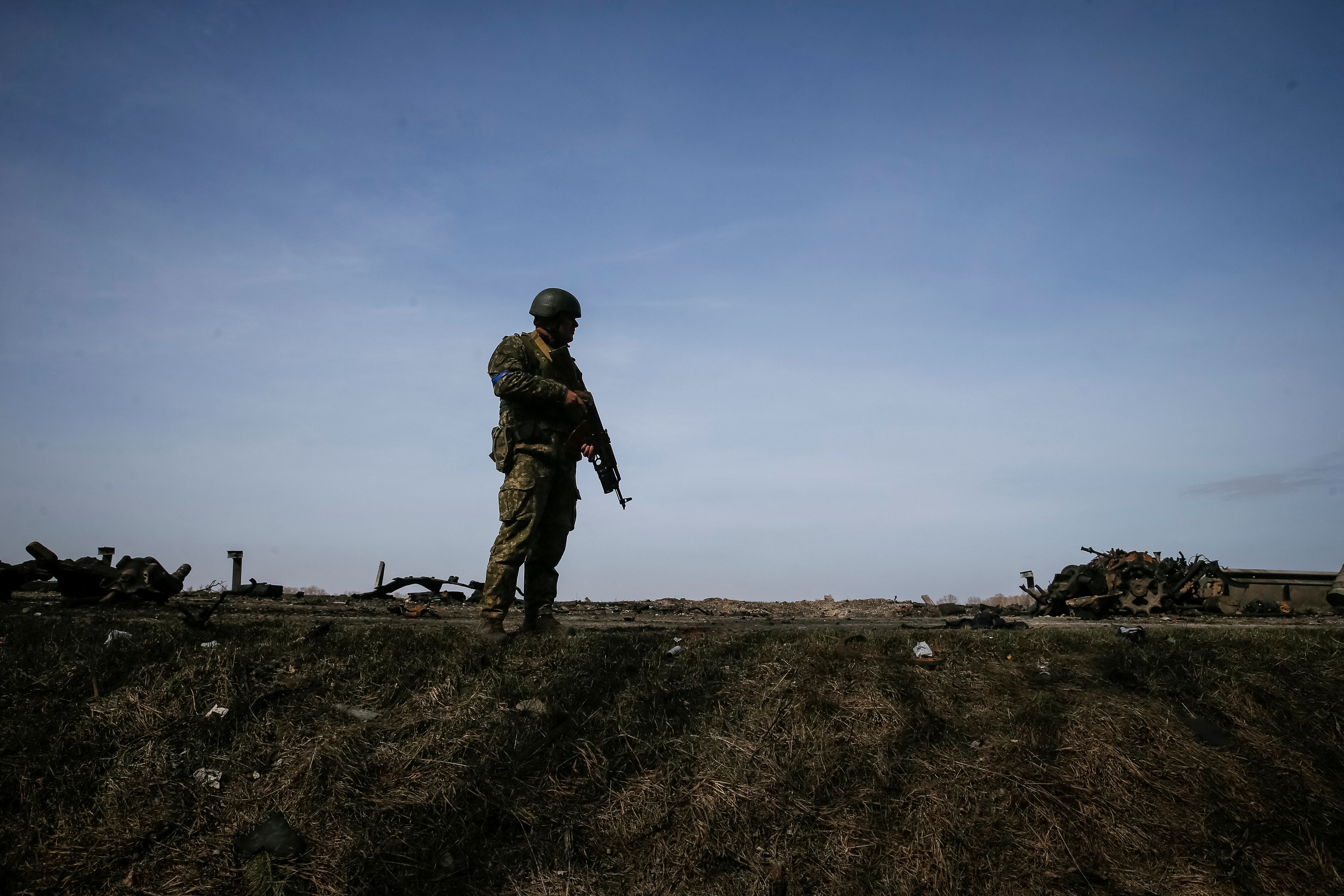 A member of the Ukrainian forces takes a position on the front line in the Kyiv region