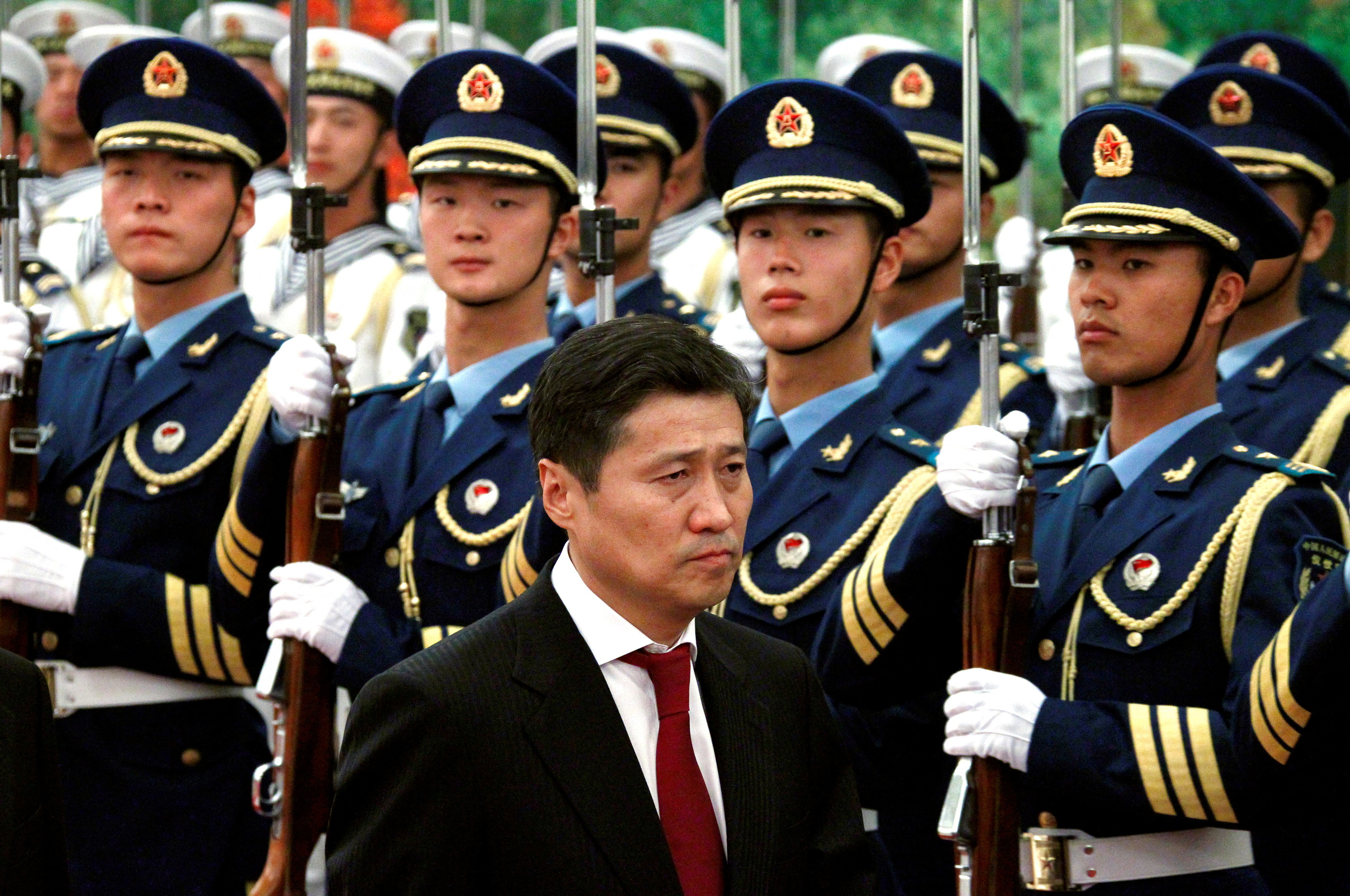 Mongolian Prime Minister Sukhbaatar Batbold inspects an honour guard during an official welcoming ceremony in the Great Hall of the People in Beijing