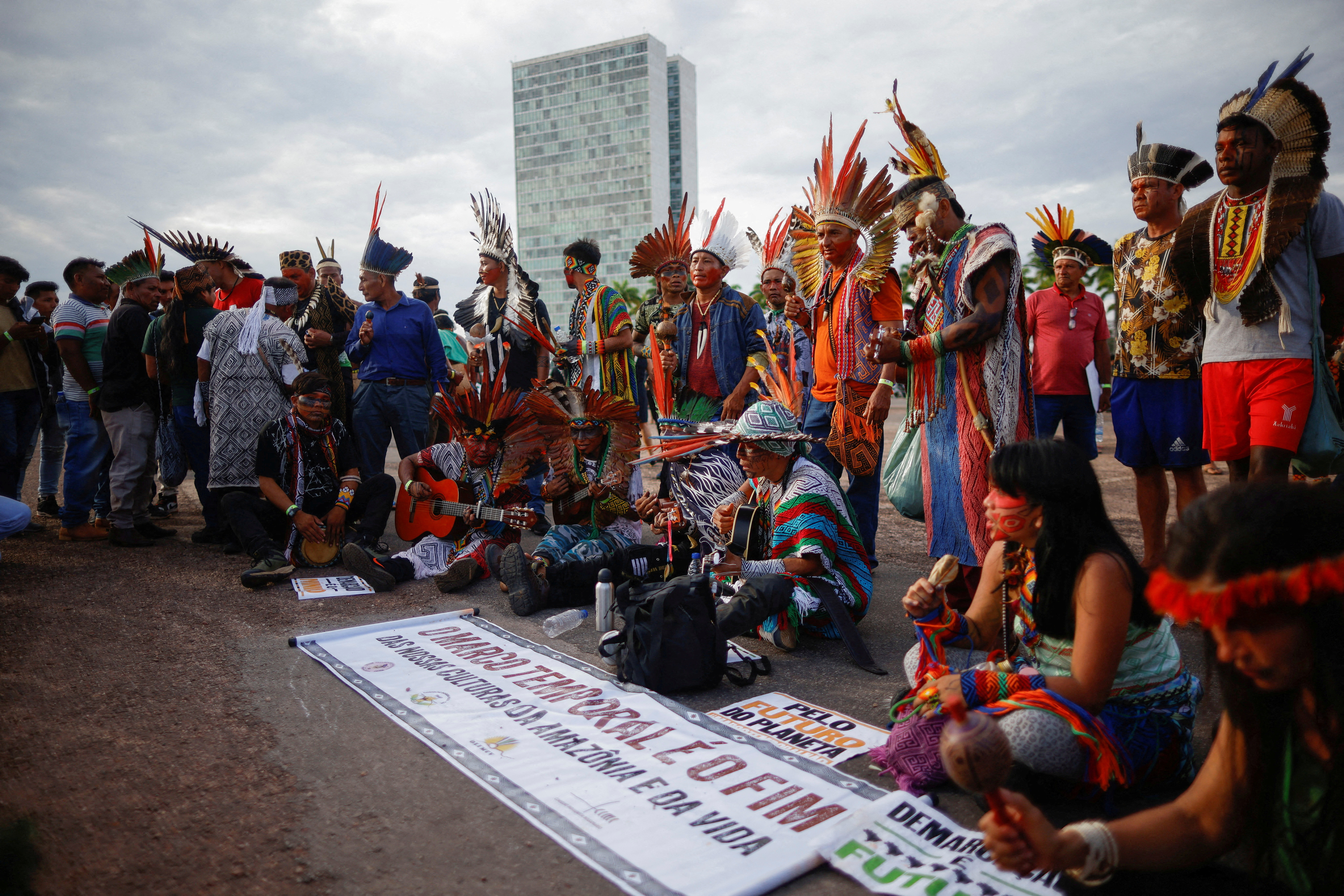Brazilian indigenous peoples gather as the Supreme Court on weighing the constitutionality of laws to limit the ability of Indigenous peoples to win protected status for ancestral lands, in Brasilia
