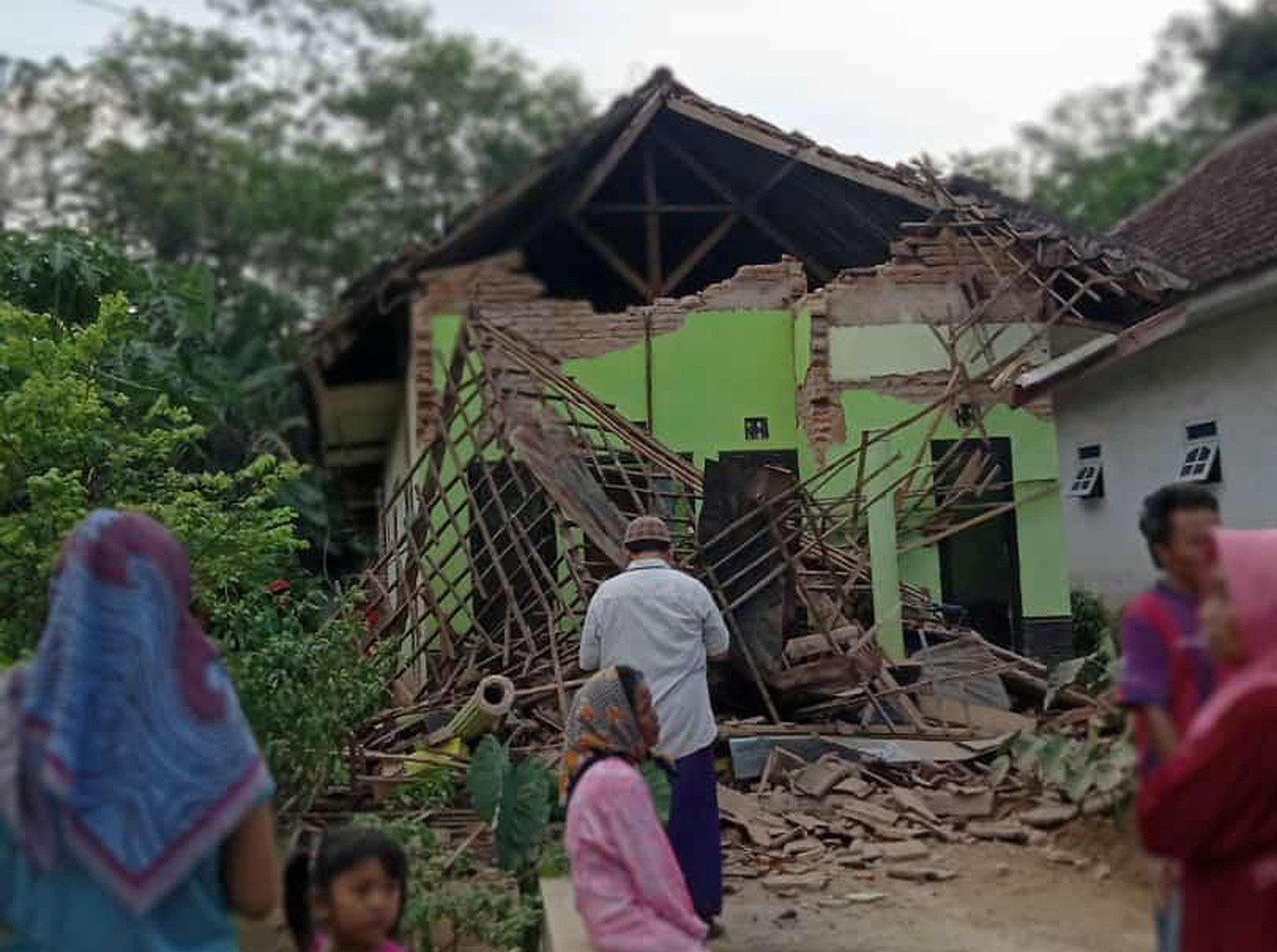 Damaged house affected by an earthquake is pictured in Malang