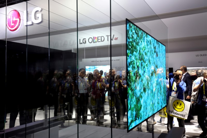 A 77-inch LG Signature W OLED television is displayed during the 2017 CES in Las Vegas