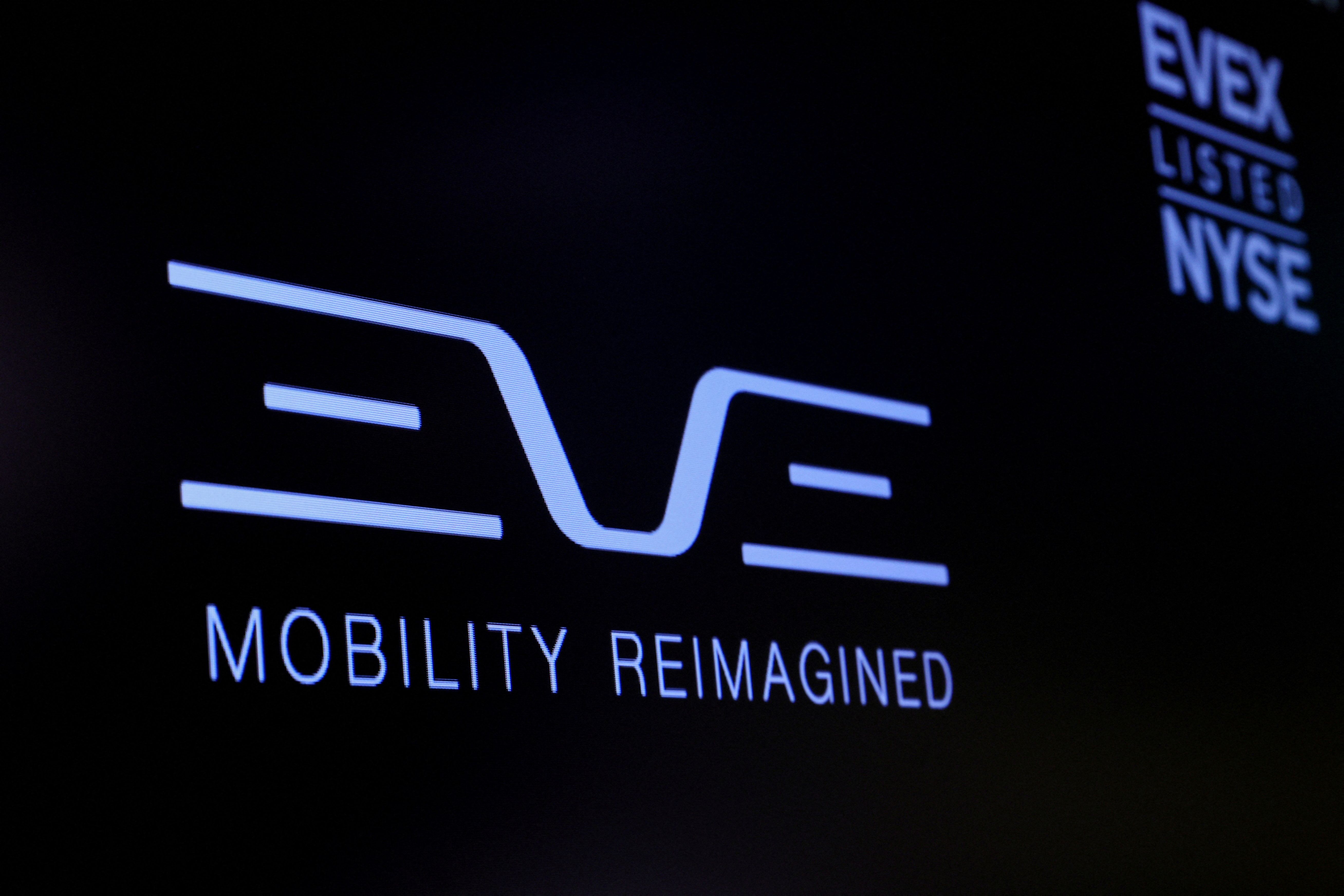 The logo for Eve Air Mobility is displayed on a screen on the floor of the NYSE in New York, U.S.