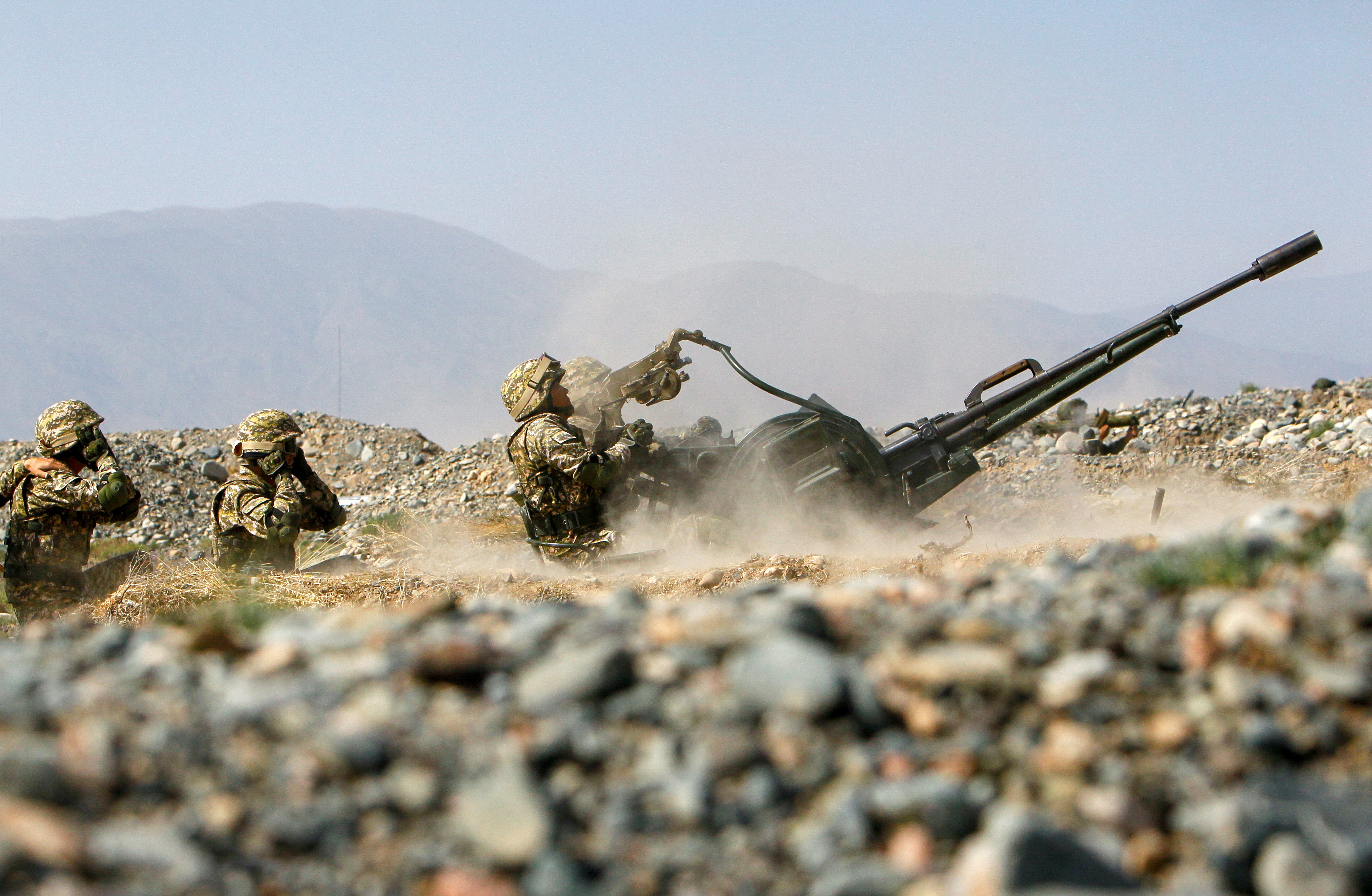 Kyrgyz service members take part in military drills at a firing range in Issyk-Kul Region