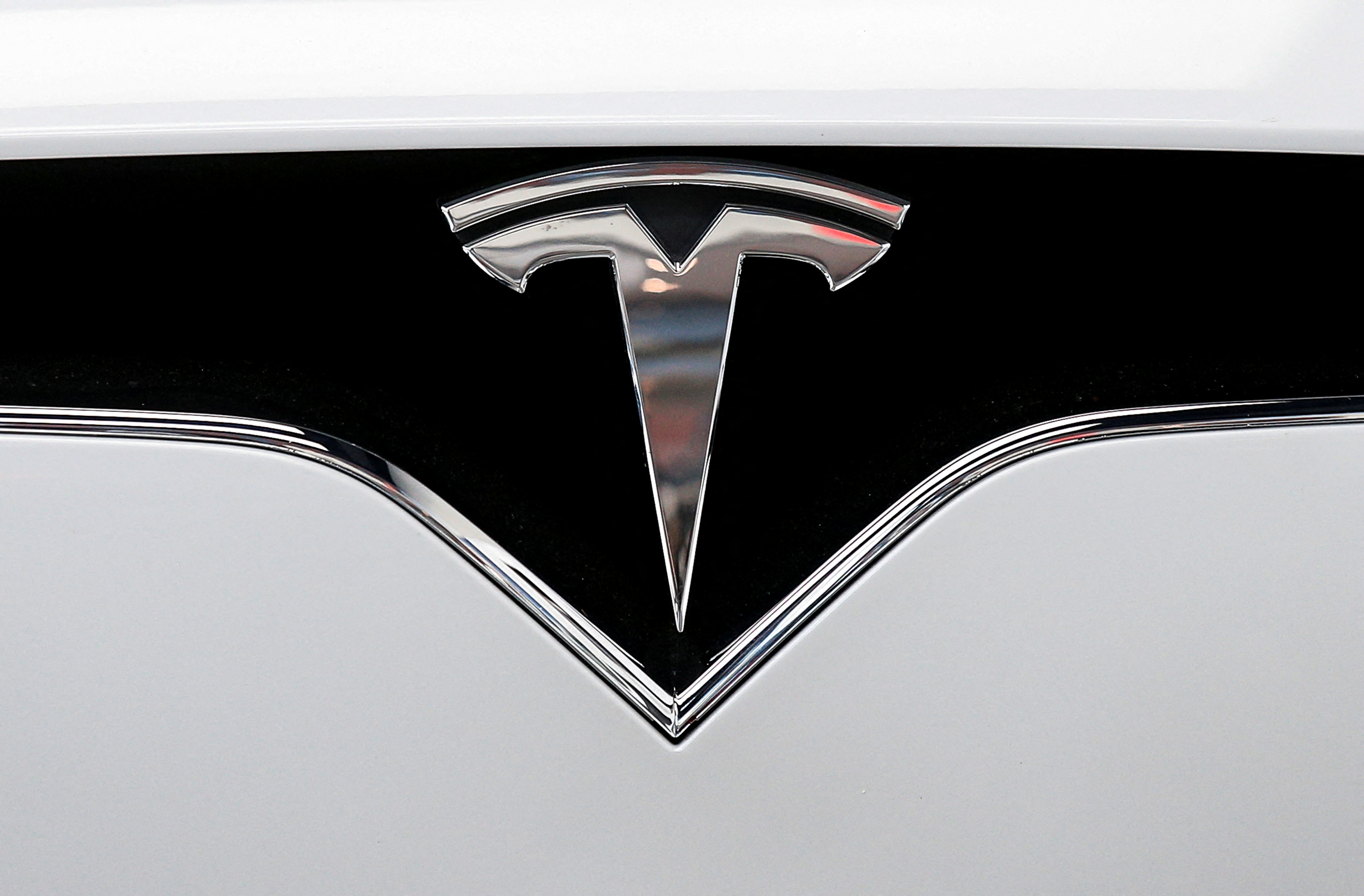 The Tesla logo is seen on a car at Tesla Motors' new showroom in Manhattan's Meatpacking District in New York