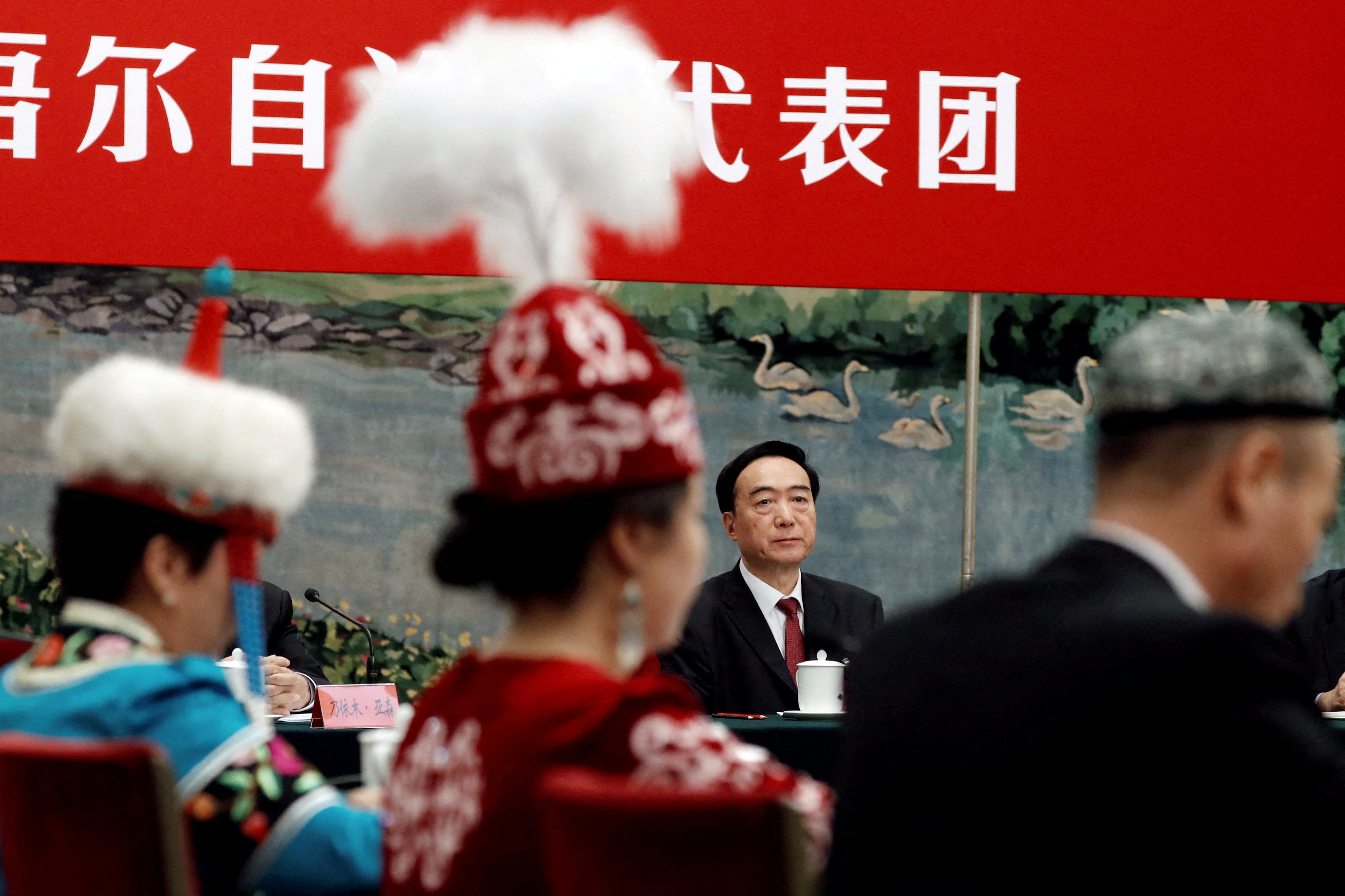 Xinjiang Uyghur Autonomous Region Party Secretary Chen Quanguo attends a group discussion session in Beijing