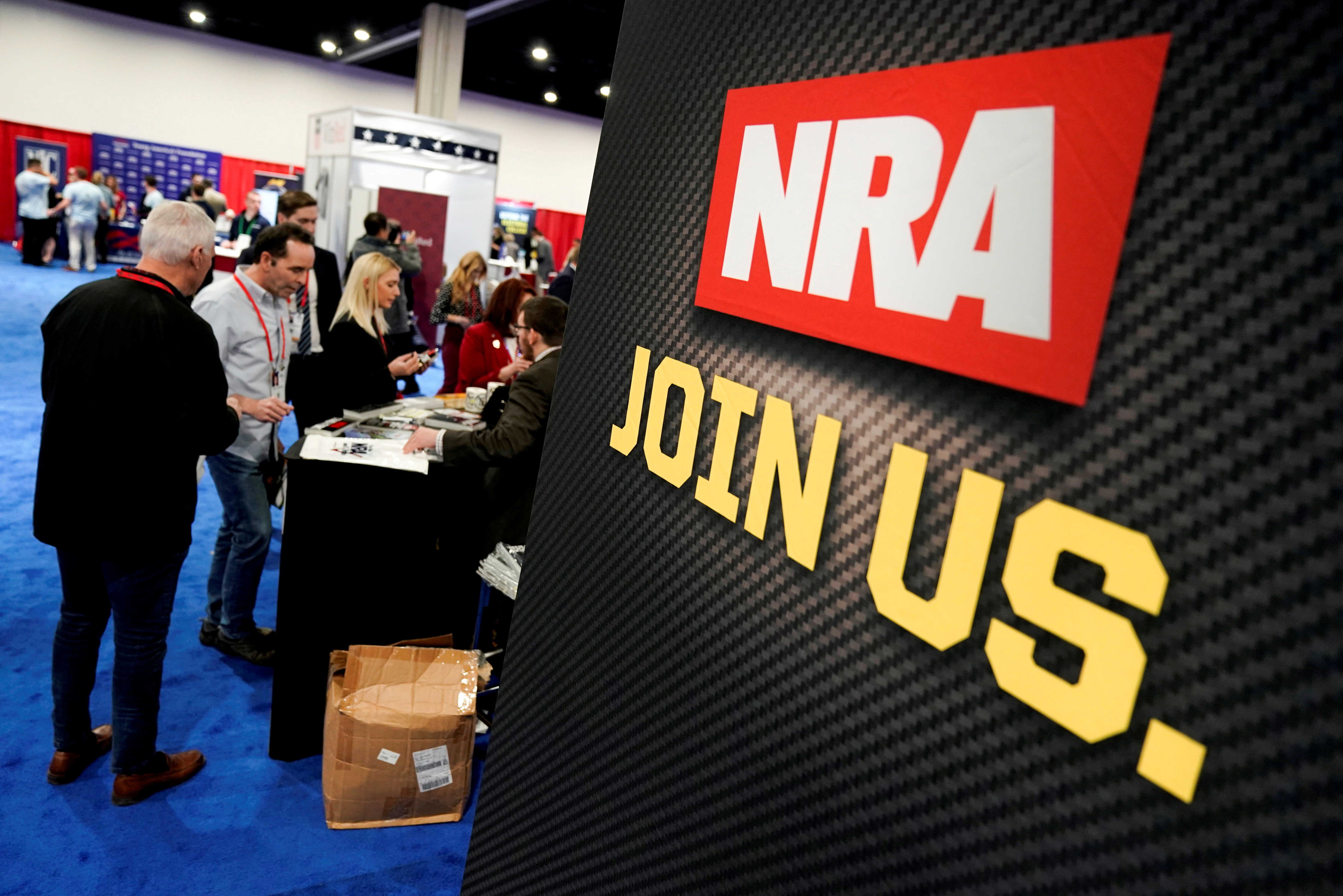 Attendees sign up at the National Rifle Association booth at the Conservative Political Action Conference in Oxon Hill, Maryland
