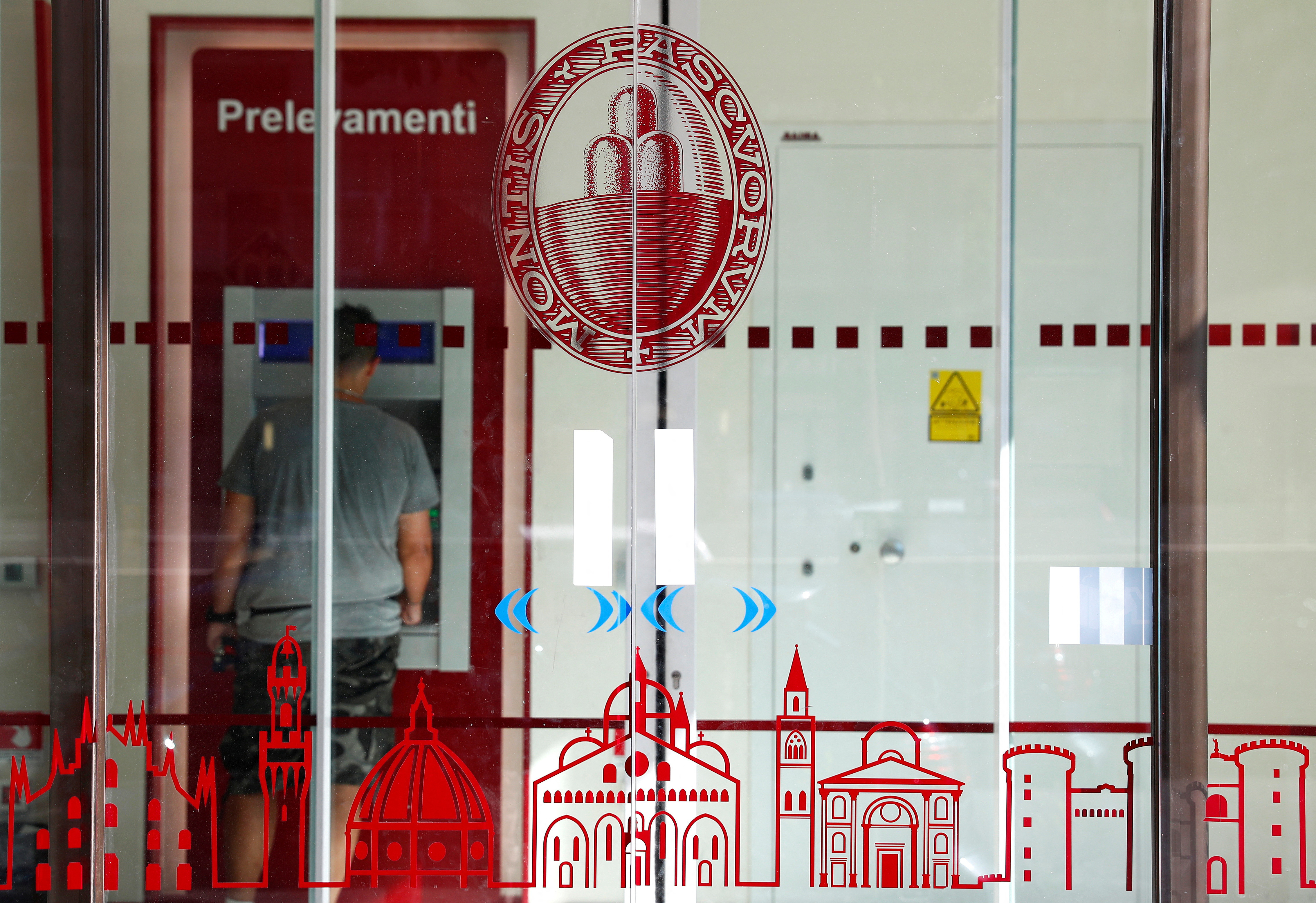 The logo of Monte dei Paschi di Siena bank is seen in a bank entrance in Rome