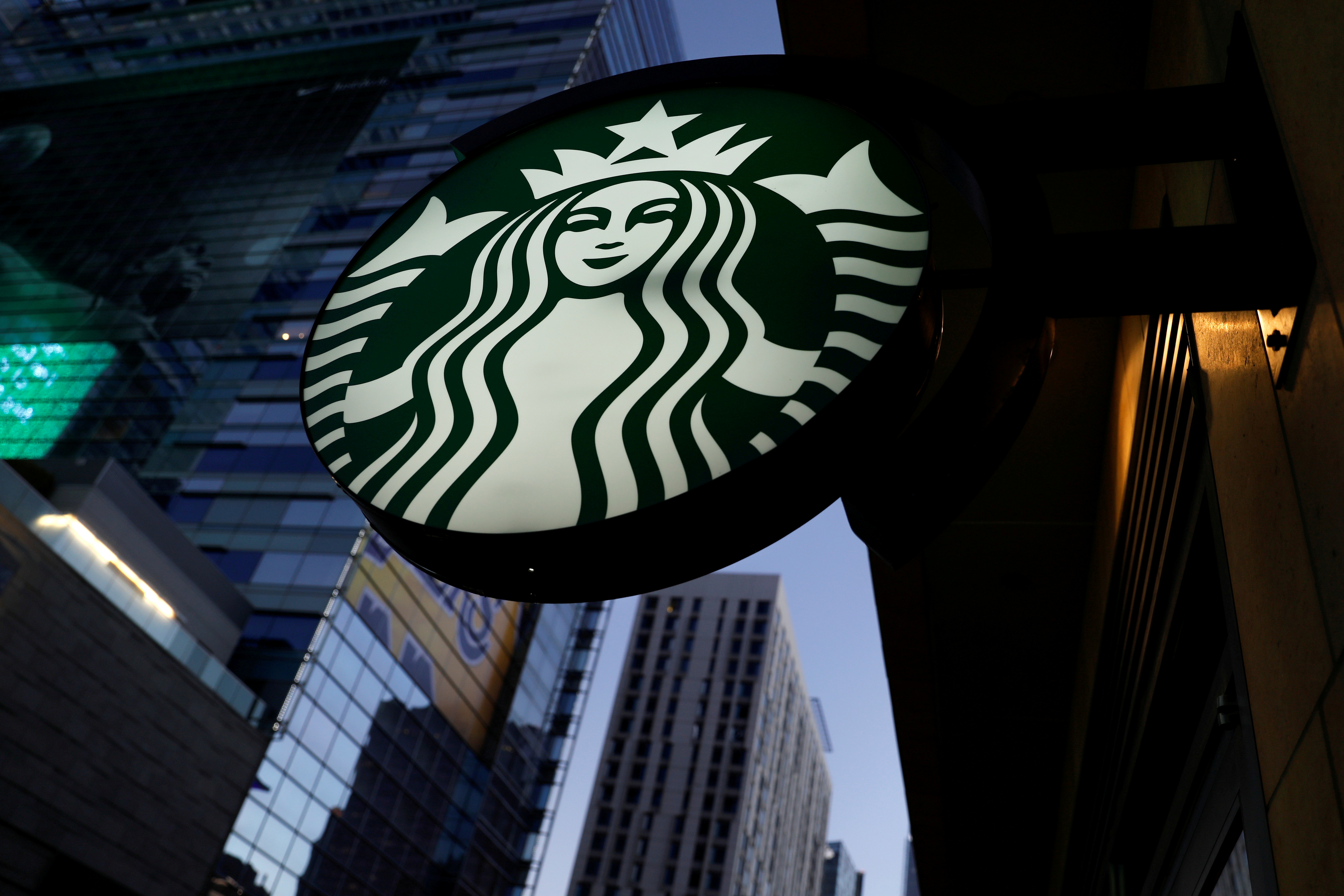 A Starbucks sign is shown on one of the company's stores in Los Angeles