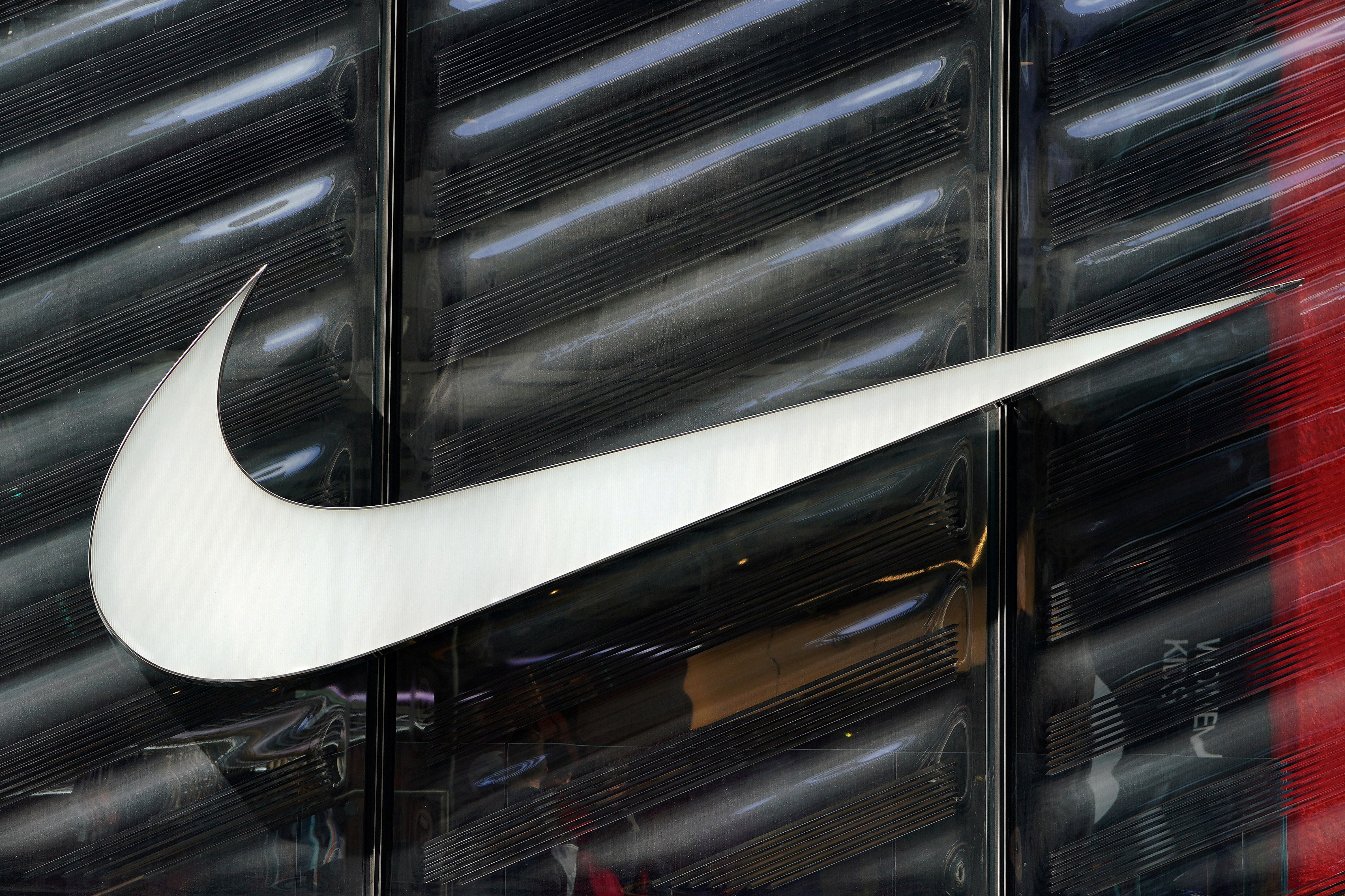 The Nike swoosh logo is seen outside the store on 5th Ave in New York