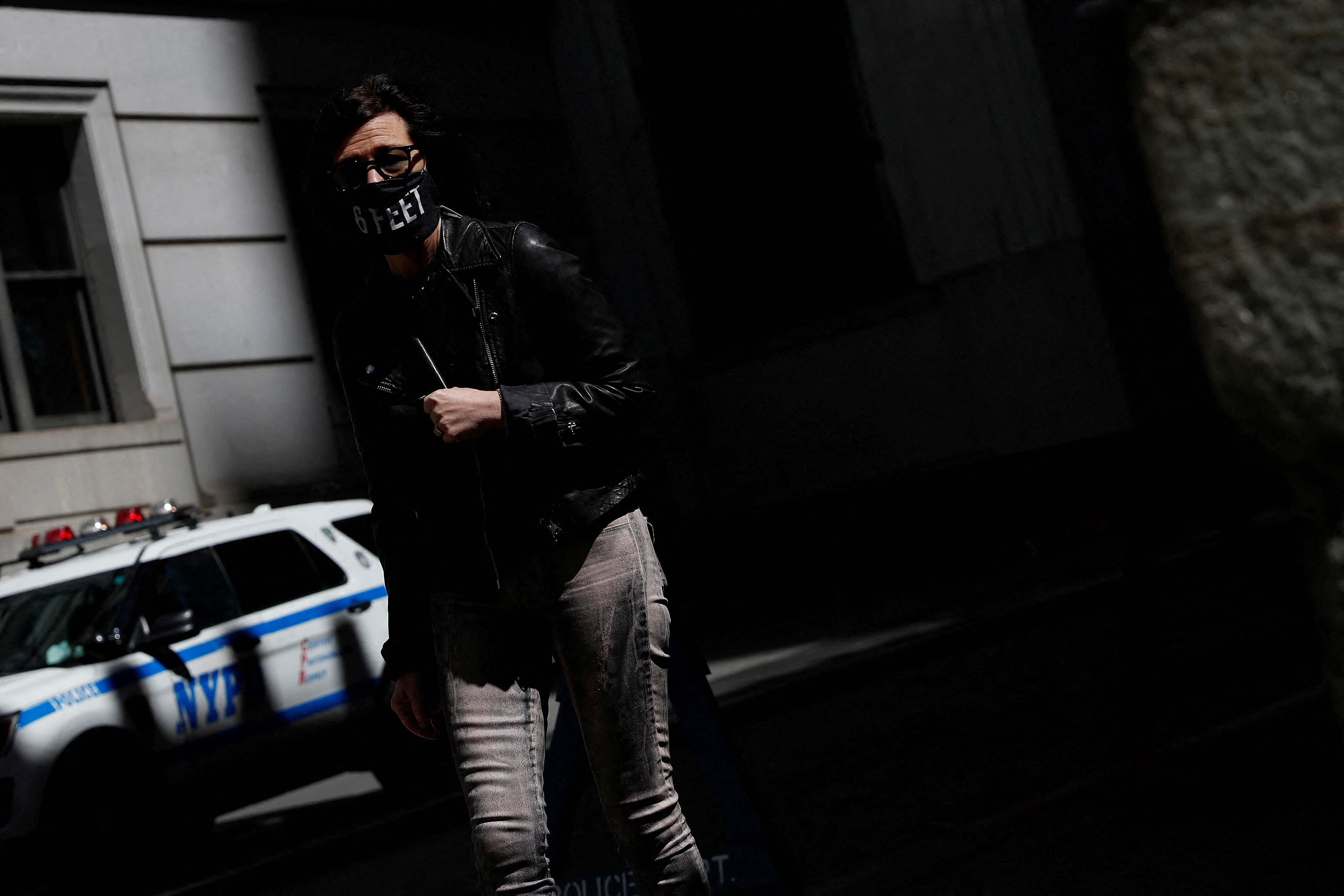 A woman wearing a protective mask that reads 
