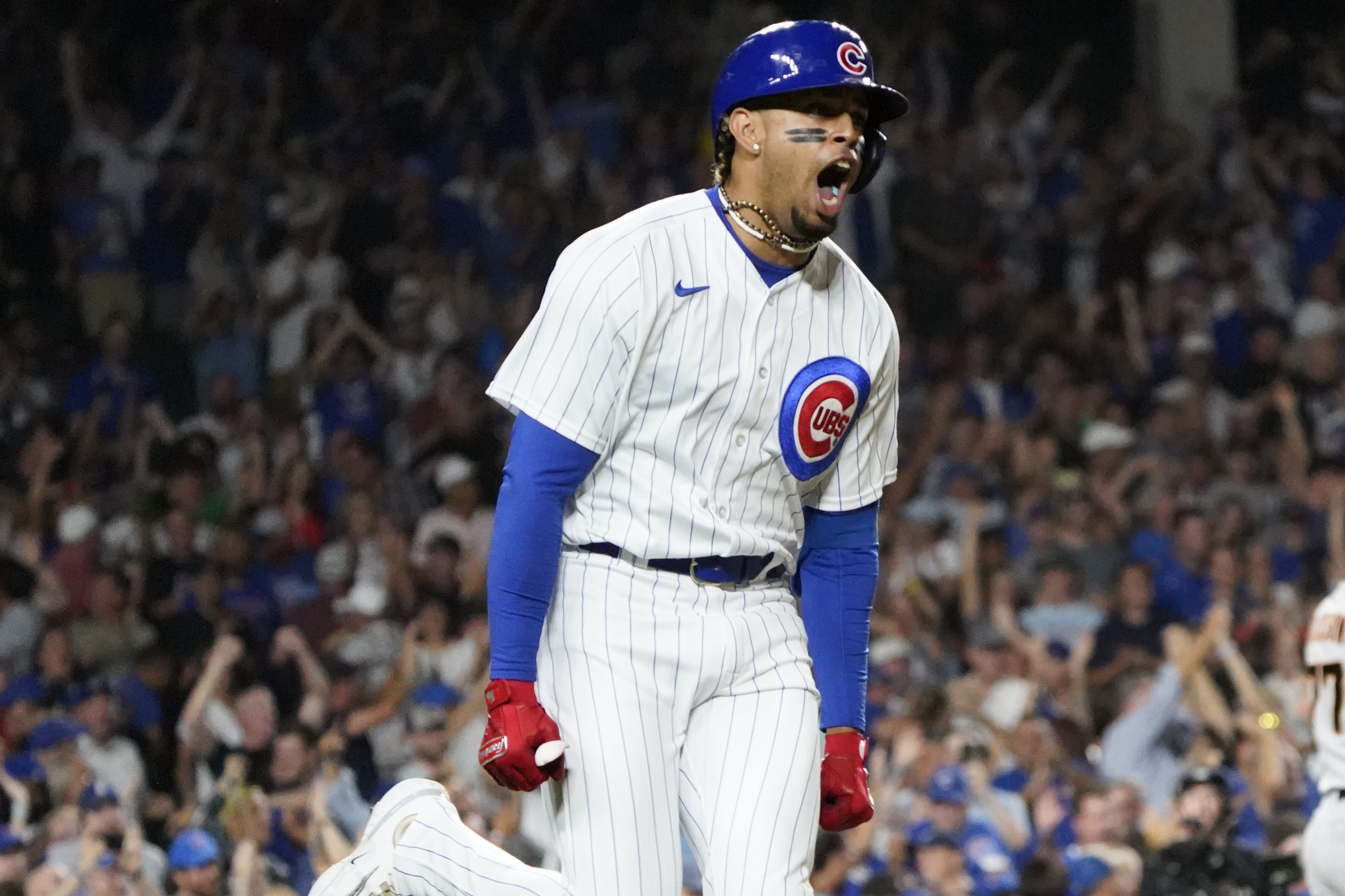 Chicago Cubs' Yan Gomes celebrates at second base after hitting an RBI  double during the seventh inning of the team's baseball game against the  Philadelphia Phillies on Tuesday, Sept. 27, 2022, in