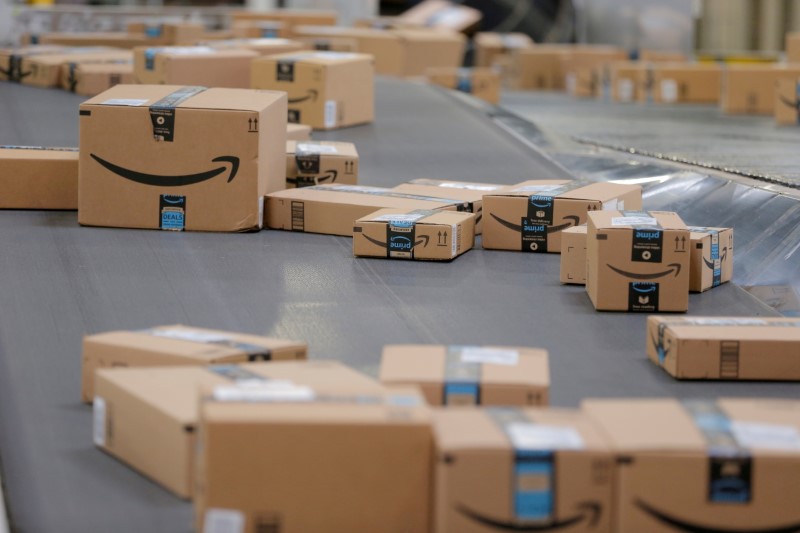 Packages travel along a conveyor belt inside of an Amazon fulfillment center in Robbinsville, New Jersey