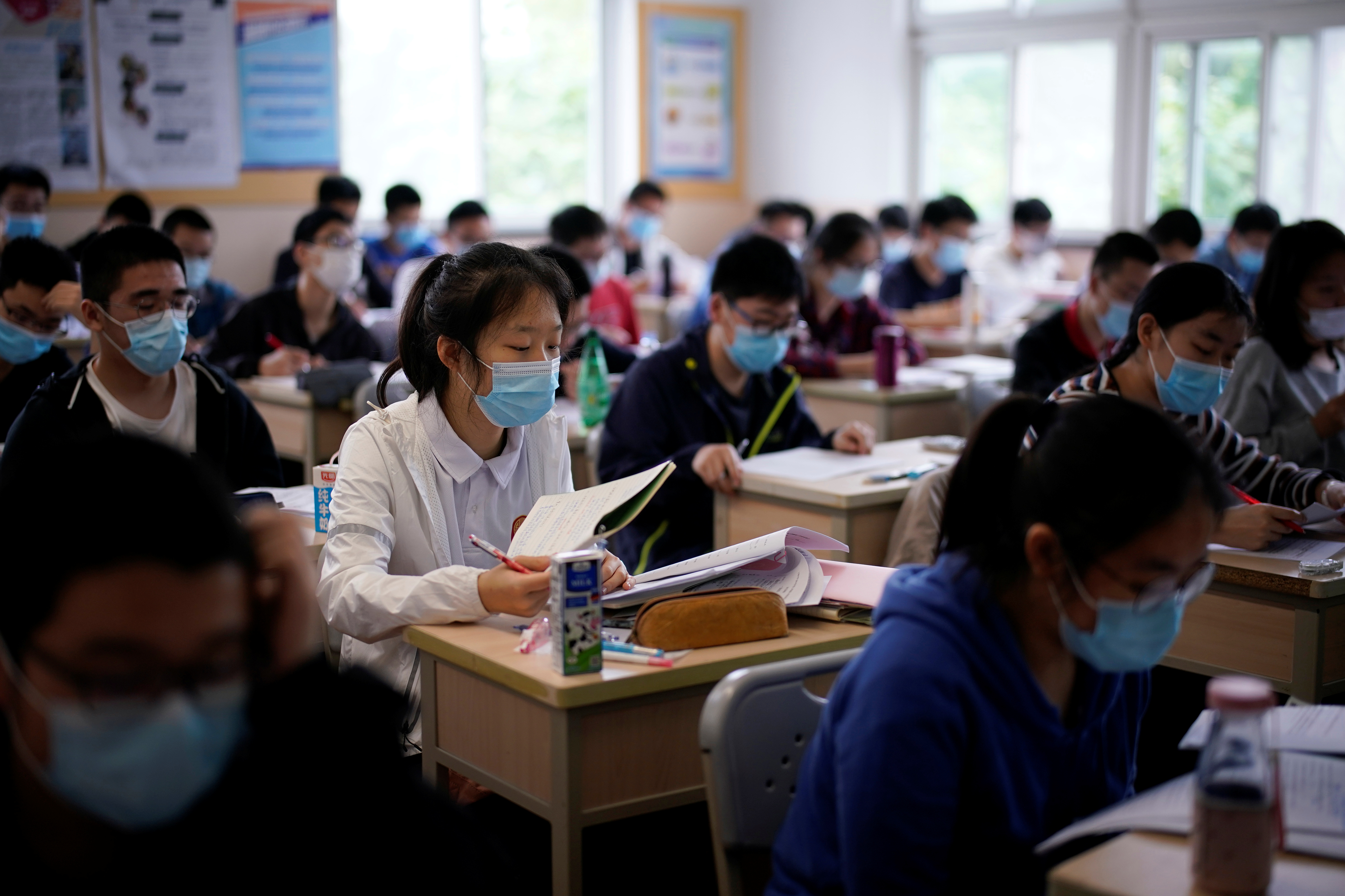 Students are seen inside a classroom at a high school in Shanghai