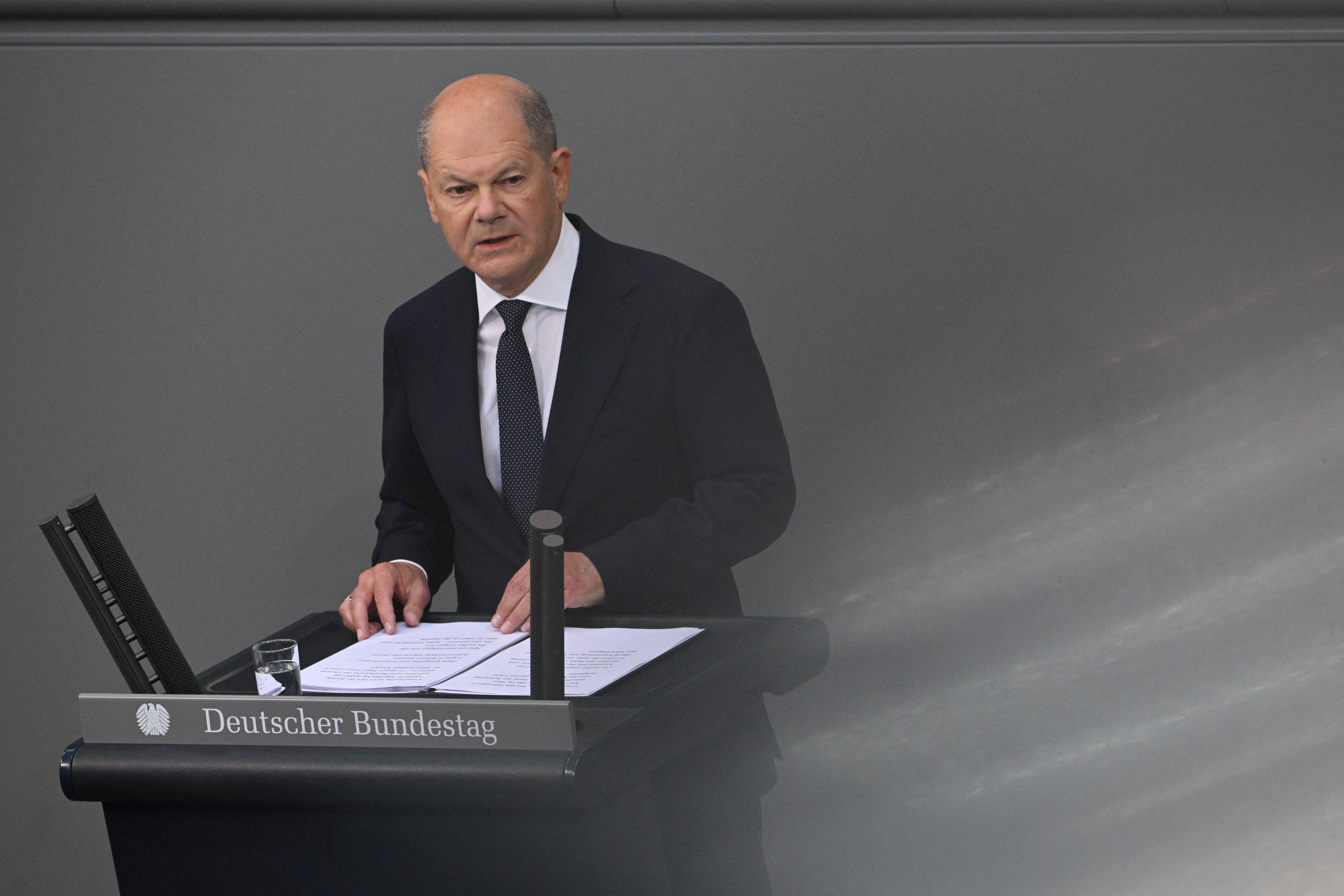 German Chancellor Olaf Scholz addresses the lower house of parliament about current security issues, in Berlin
