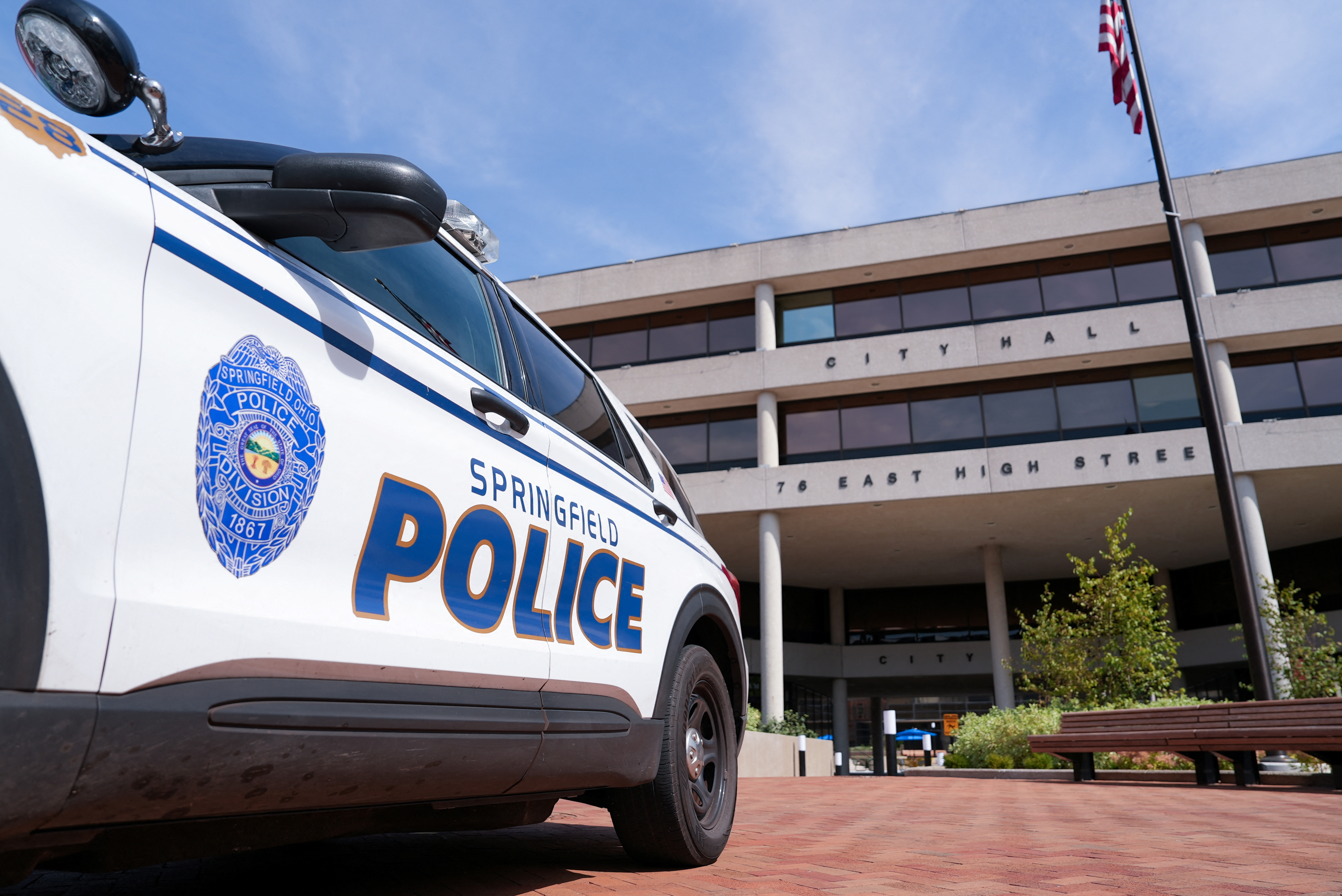 A police car sits outside Ohio City Hall which received a bomb threat and was evacuated Thursday morning, in Springfield