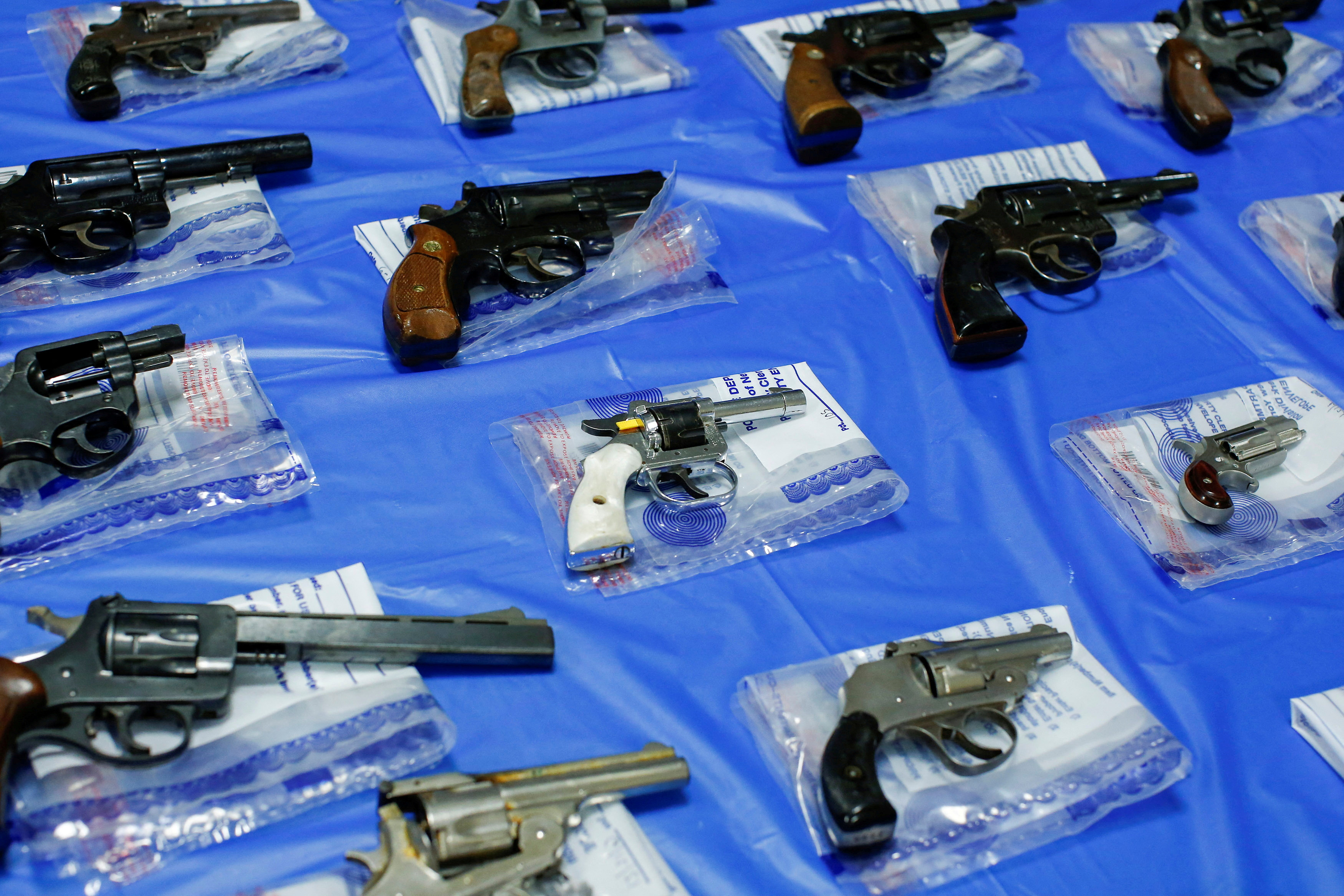Guns are displayed after a gun buyback event organized by the NYPD, in the Queens borough of New York City