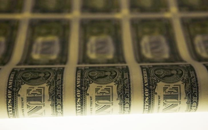 A sheet of United States one dollar bills is seen on a light table during production at the Bureau of Engraving and Printing in Washington