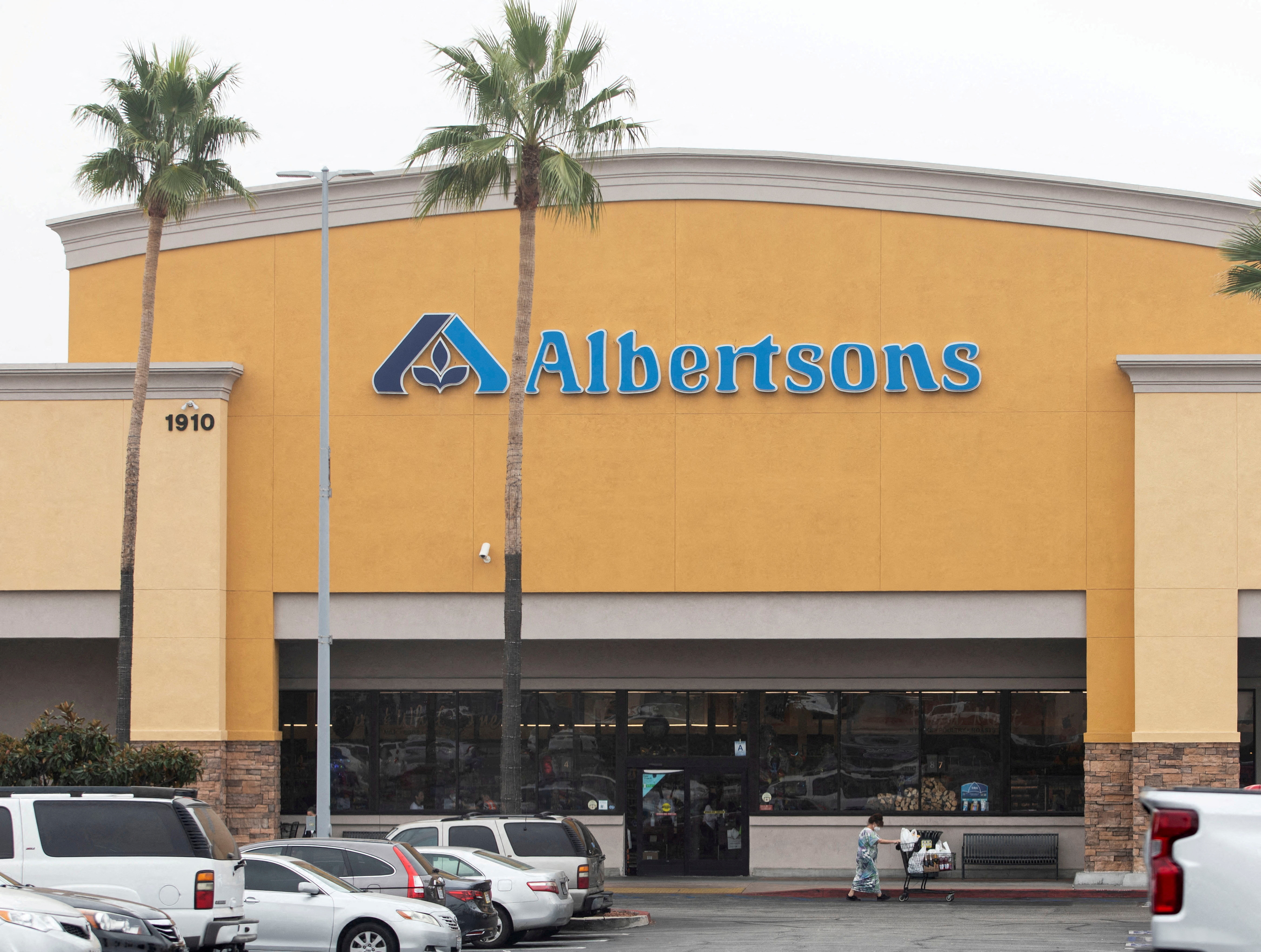 A customer leaves an Albertsons grocery store in Riverside