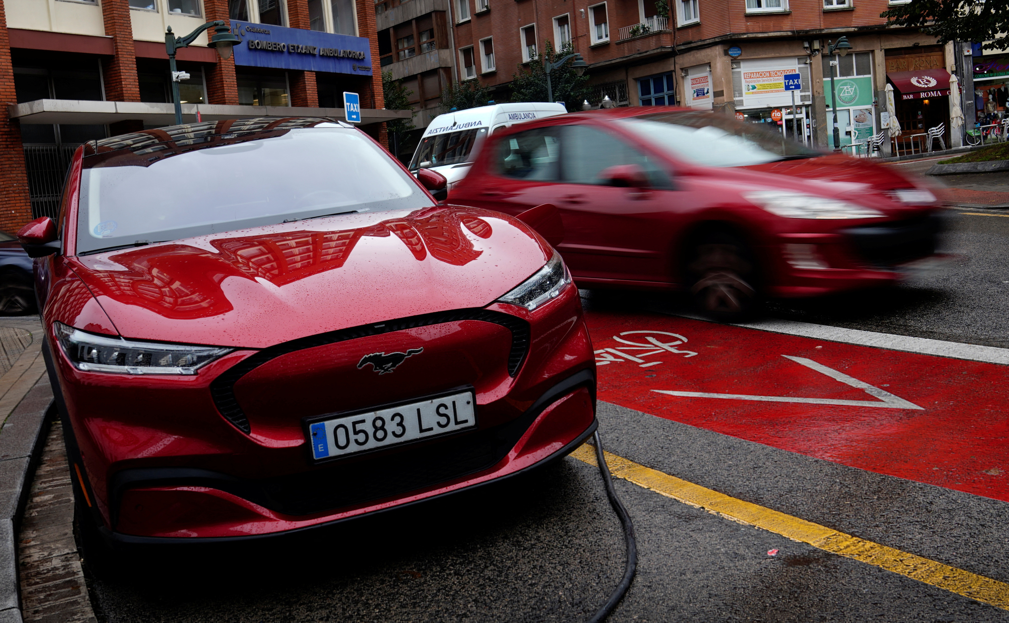 A Ford Mustang Mach-e electric vehicle is seen plugged into a charging station in Bilbao