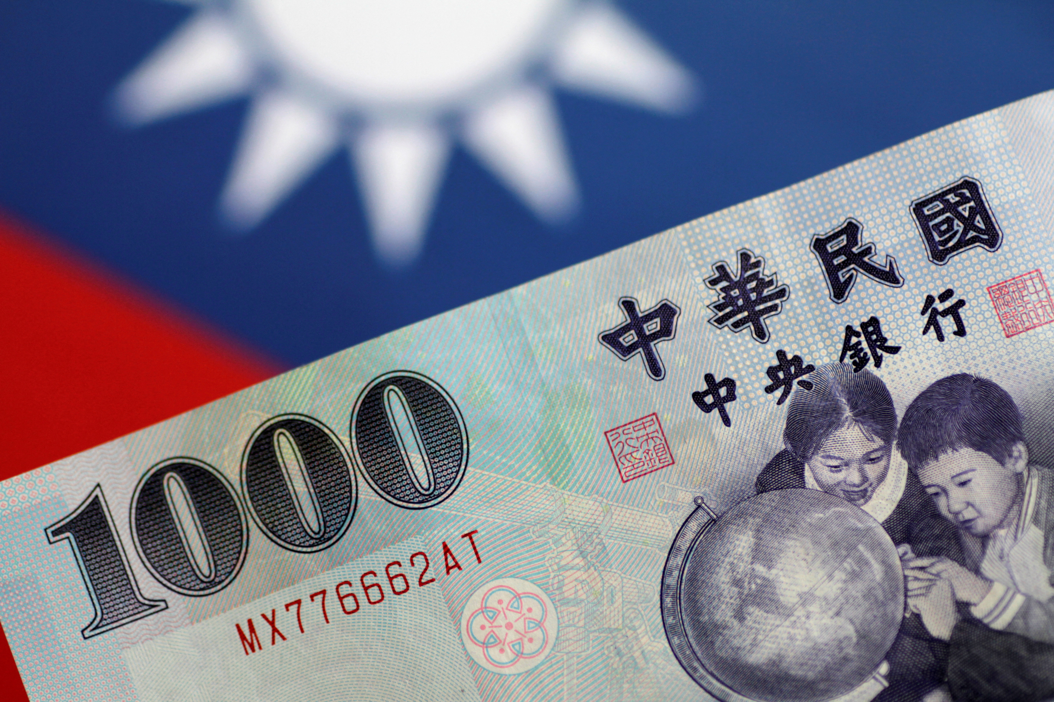 Bulls pile up on Taiwan dollar most since late 2020, trim long position on  rupee | Reuters