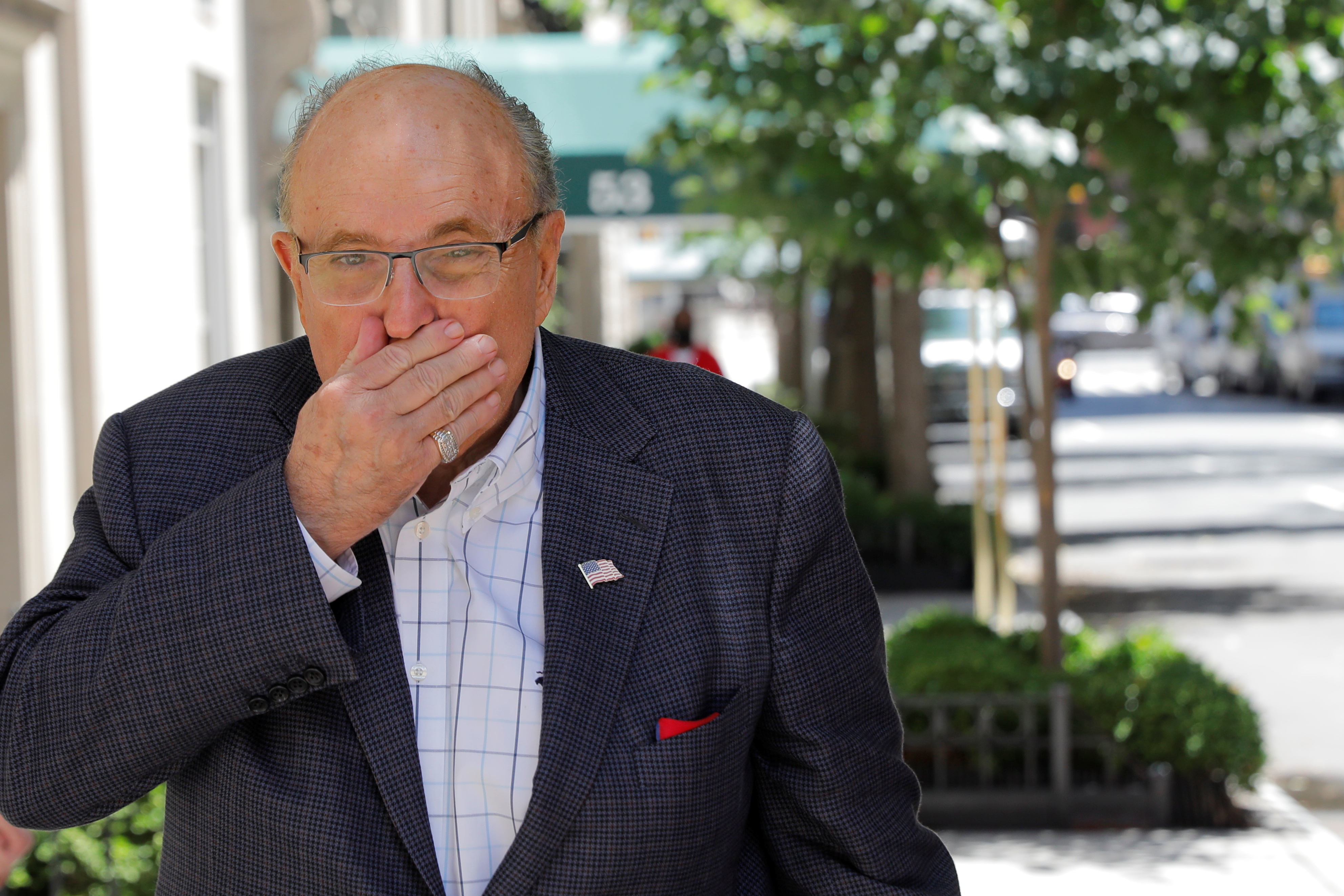 Former New York City Mayor Rudy Giuliani arrives at his apartment building after the suspension of his law license in Manhattan in New York City