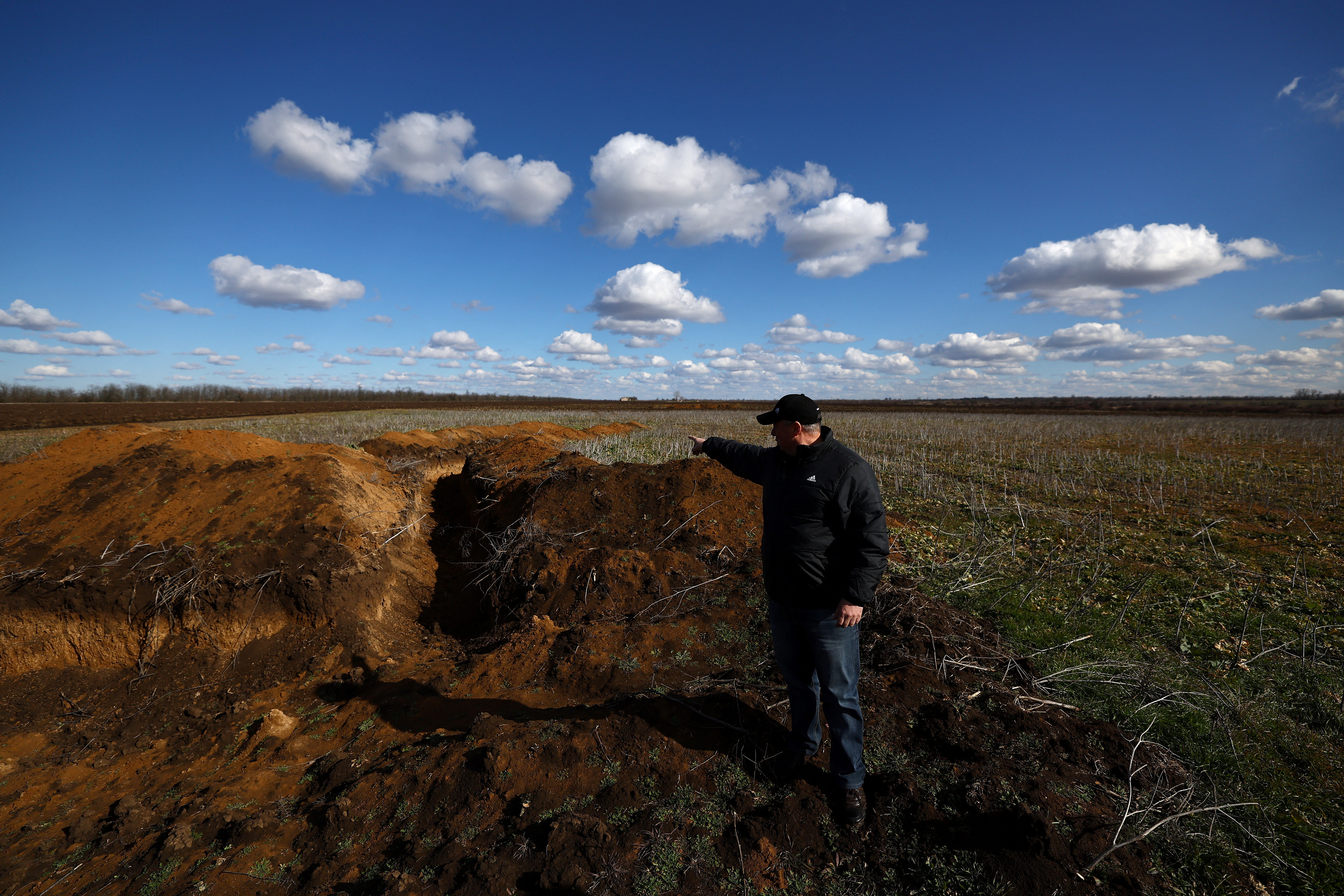 Ukraine's farmers sow bitter crop into mined fields