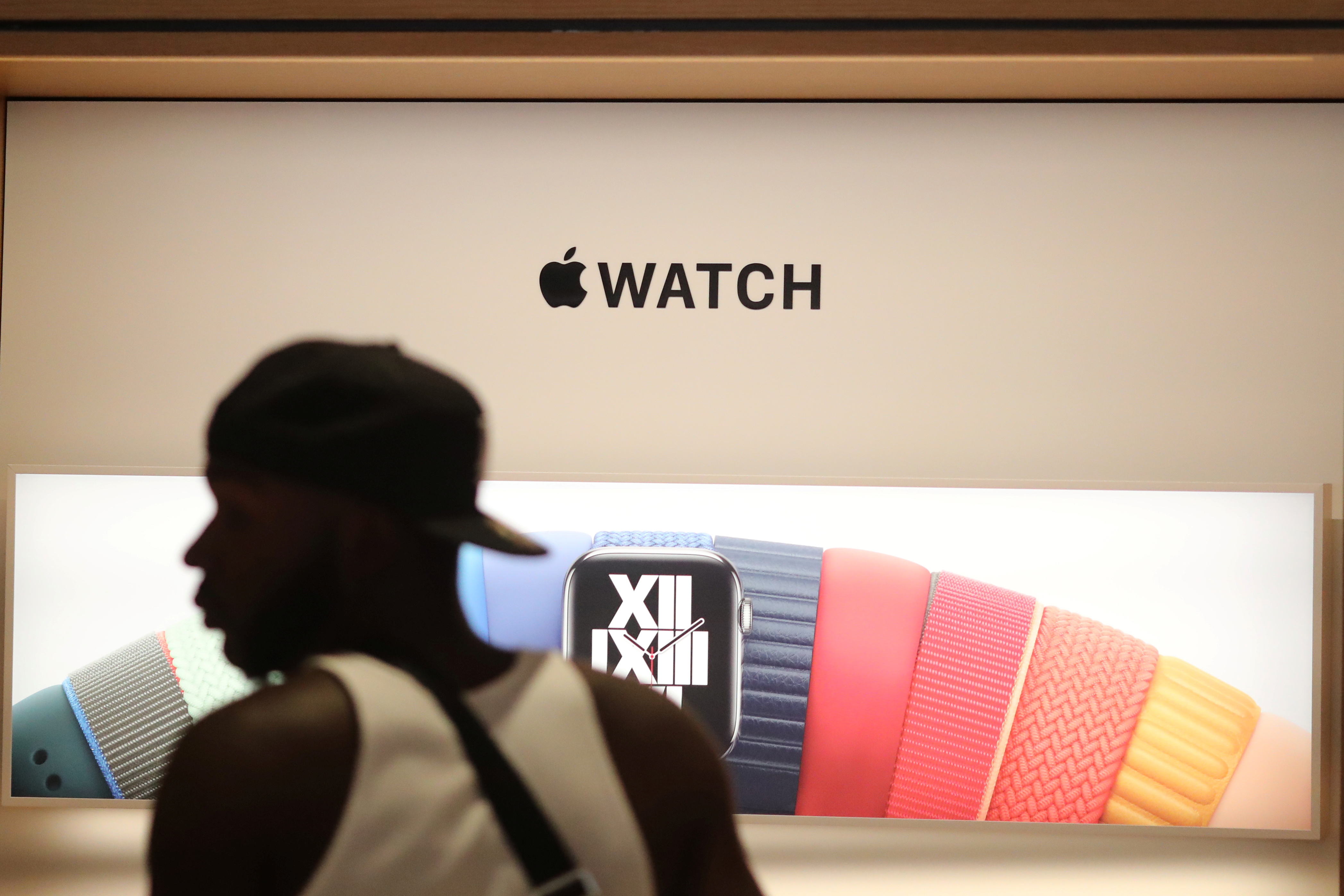 A customer browses Apple watches at the new Apple Store on Broadway in downtown Los Angeles