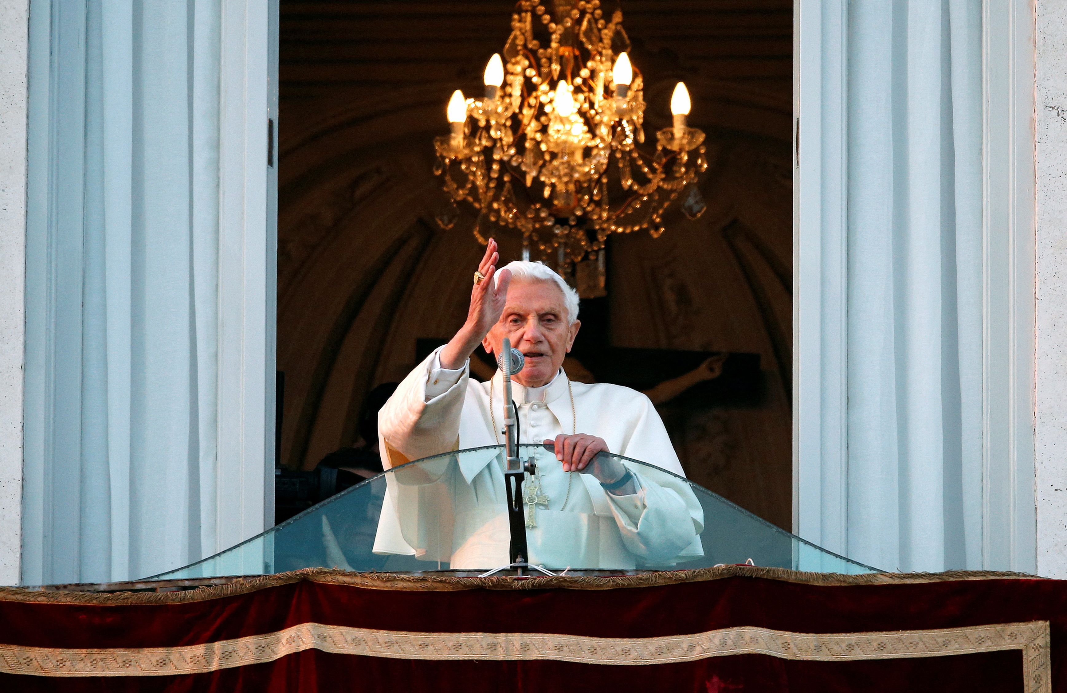 Pope Benedict XVI blesses the faithful for the last time from the balcony of his summer residence in Castel Gandolfo