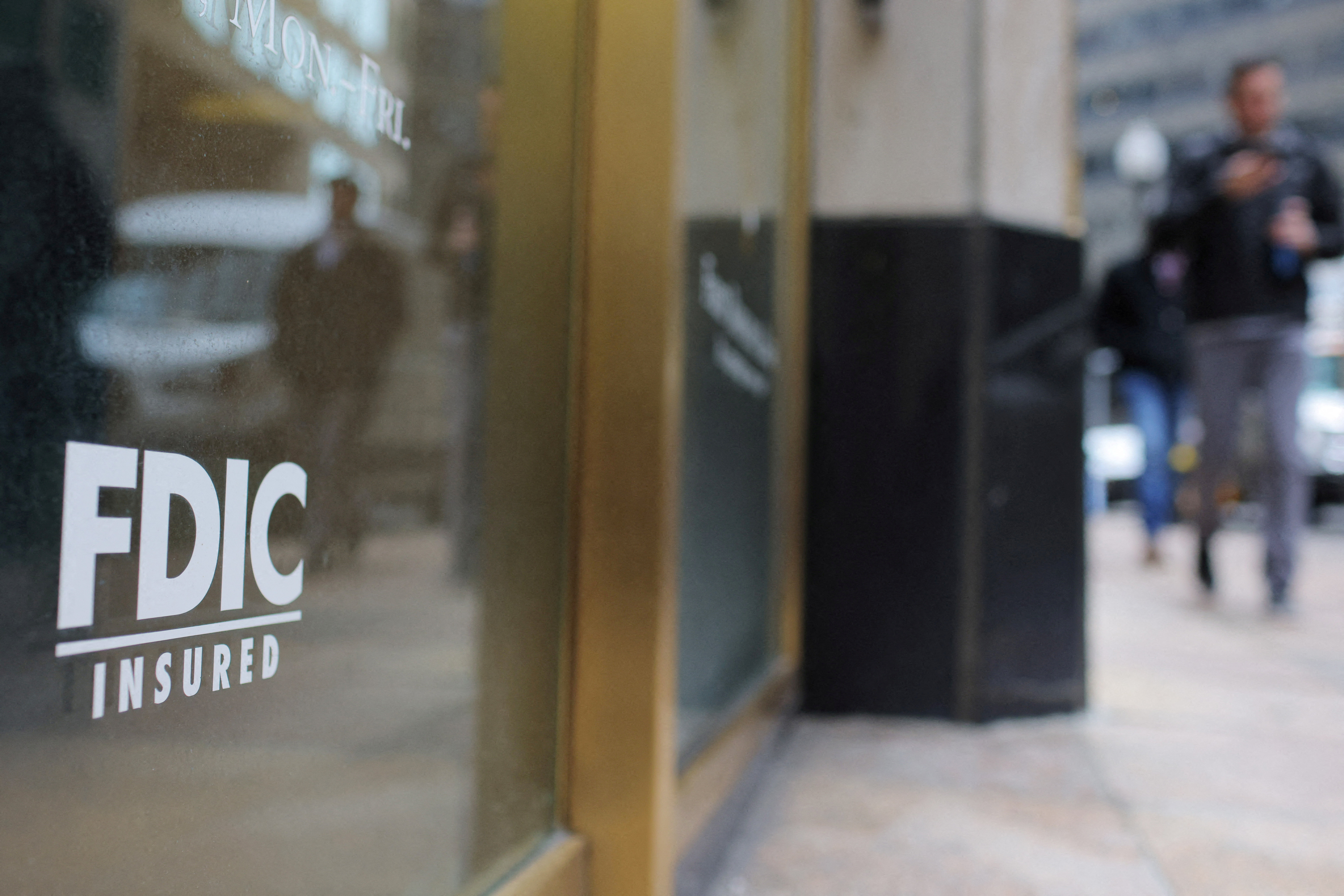 A sign reads “FDIC Insured” on the door of a branch of First Republic Bank in Boston, Massachusetts, U.S., March 13, 2023.