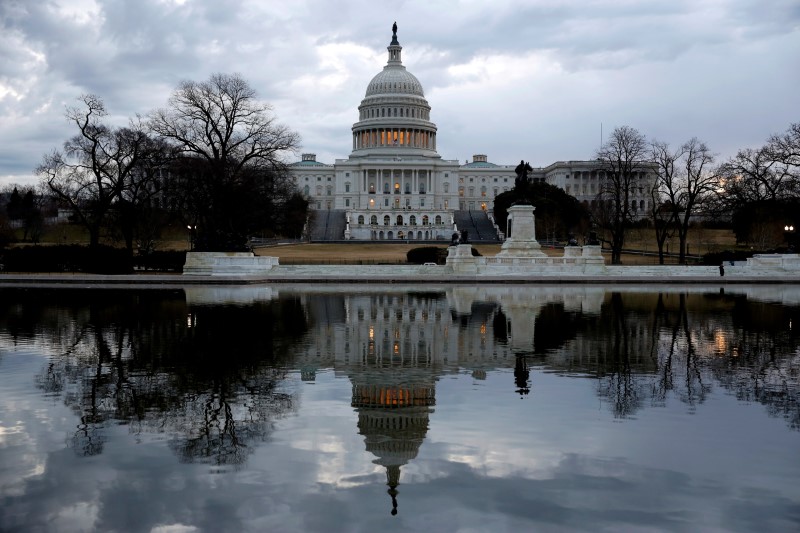 Clouds pass over the U.S. Capitol at the start of the third day of a shut down of the federal government in Washington