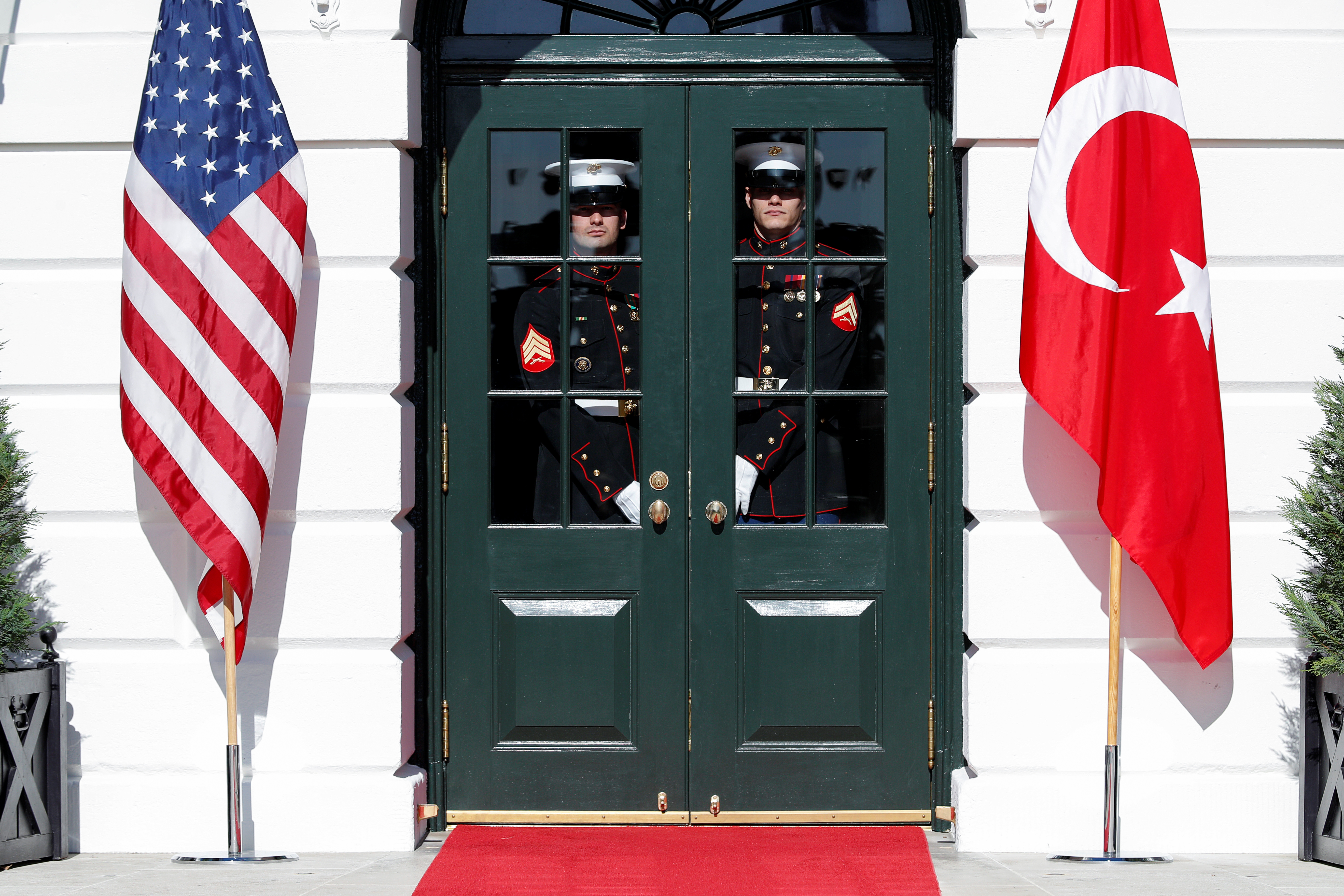 U.S. Marines stand at the South Portico entrance prior to U.S. President Donald Trump welcoming Turkey’s President Tayyip Erdogan at the White House in Washington, U.S., November 13, 2013. REUTERS/Tom Brenner
