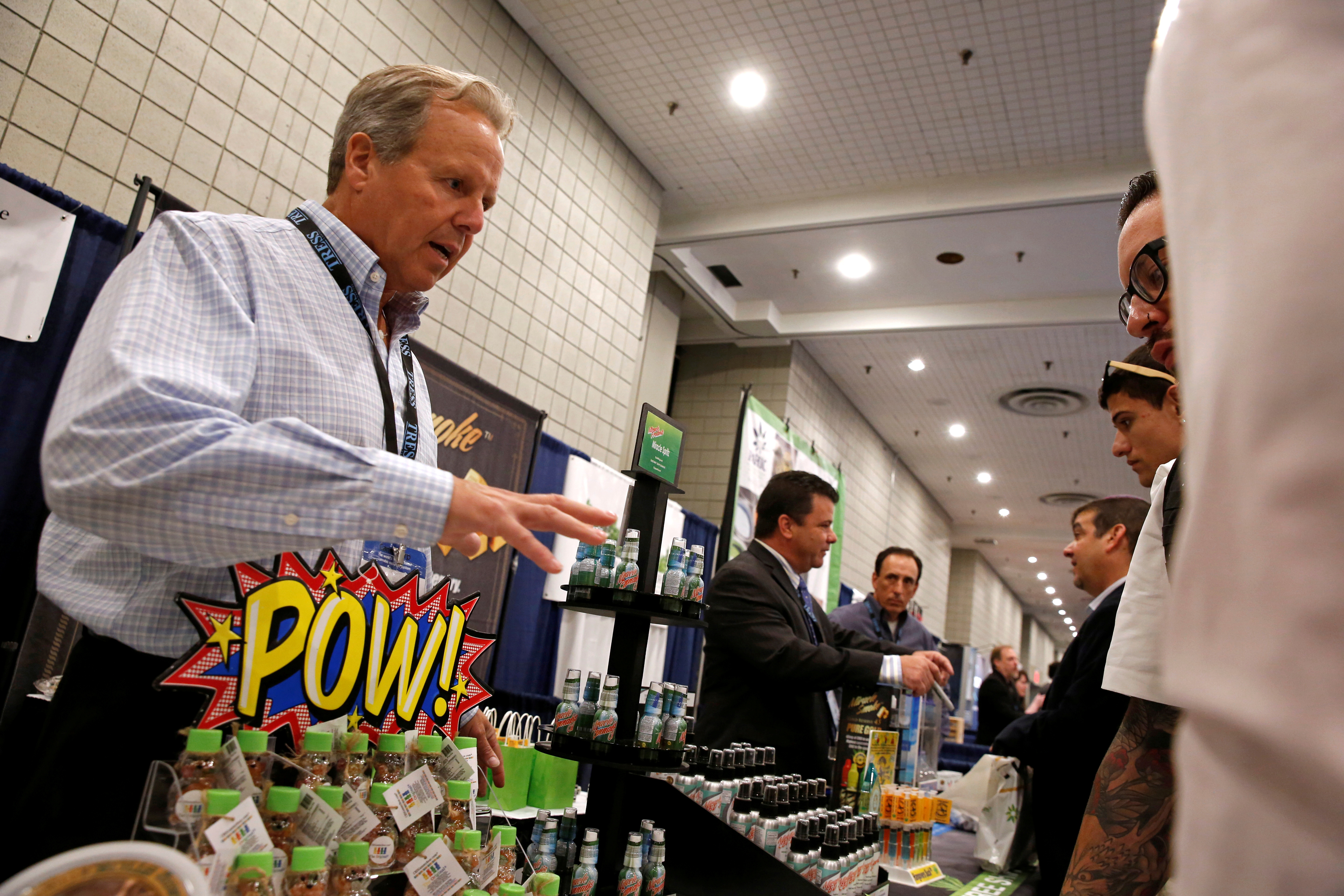 A representative of a cannabis-based product company interacts with attendees during the Cannabis World Congress & Business Exposition in New York City