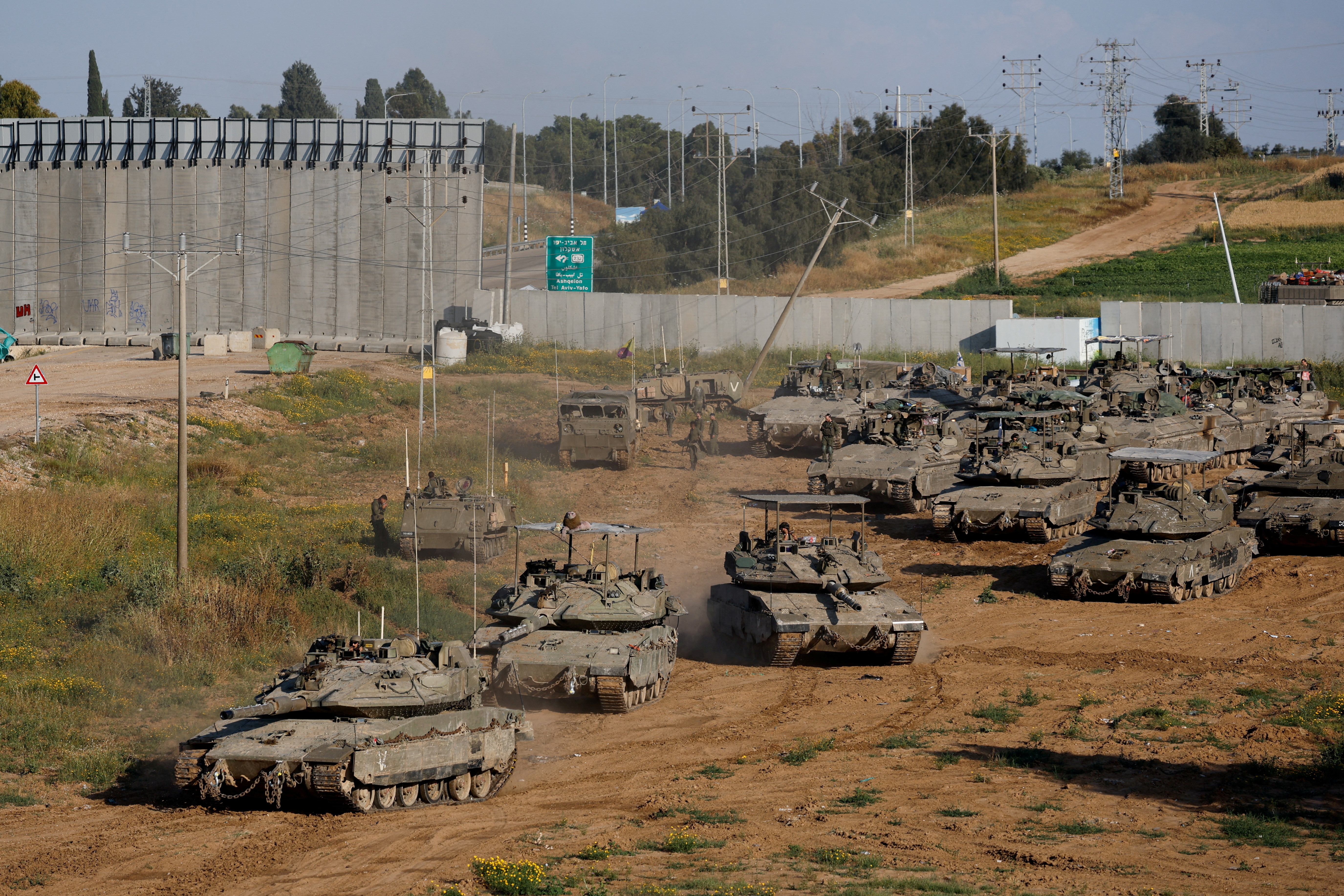 Israeli soldiers prepare near the Israel-Gaza border