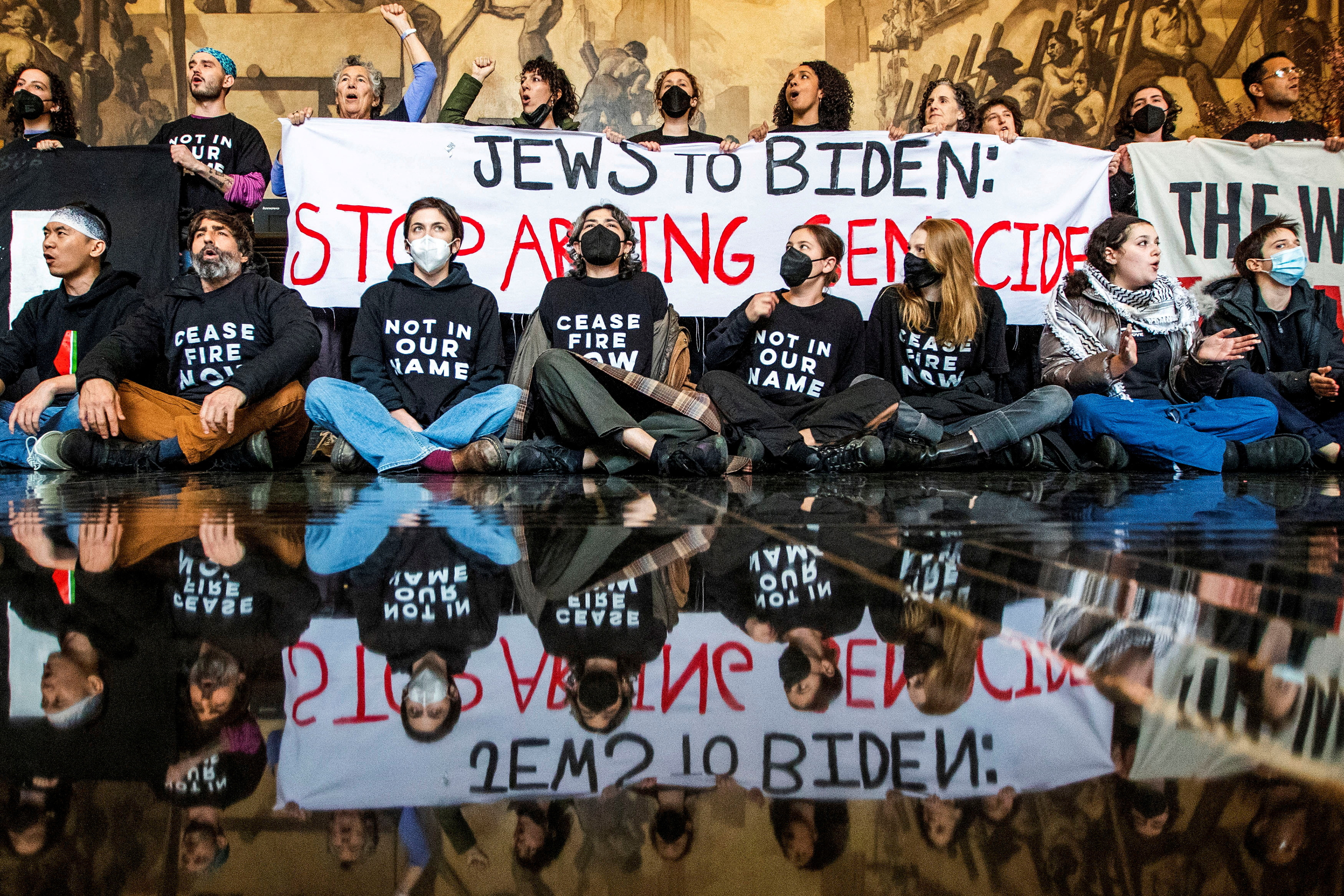 Protesters ask for a ceasefire in the ongoing conflict between Israel and the Palestinian Islamist group Hamas, as U.S. President Biden attends an interview in New York