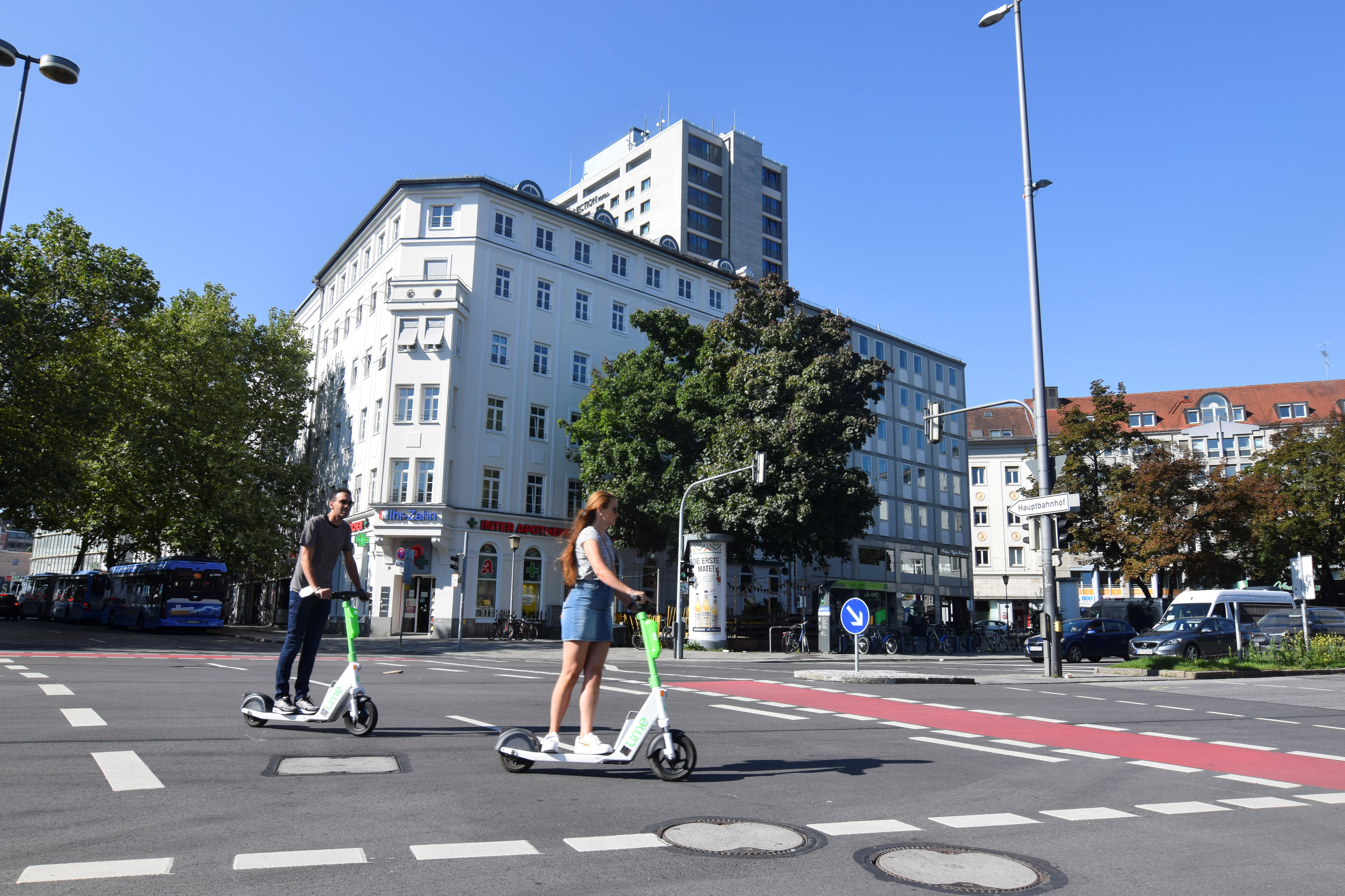 E-scooter users riding scooters rented out from micromobility firm Lime in Munich, Germany, September 5, 2021. Picture taken September 5, 2021. REUTERS/Nick Carey