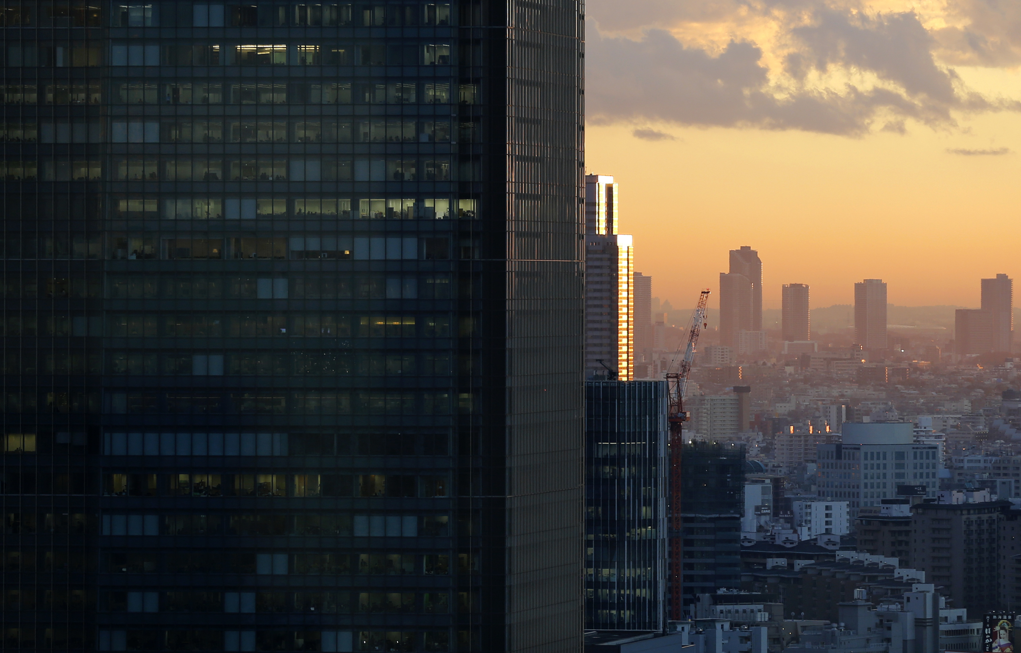 High-rise office buildings are seen during sunset in Tokyo
