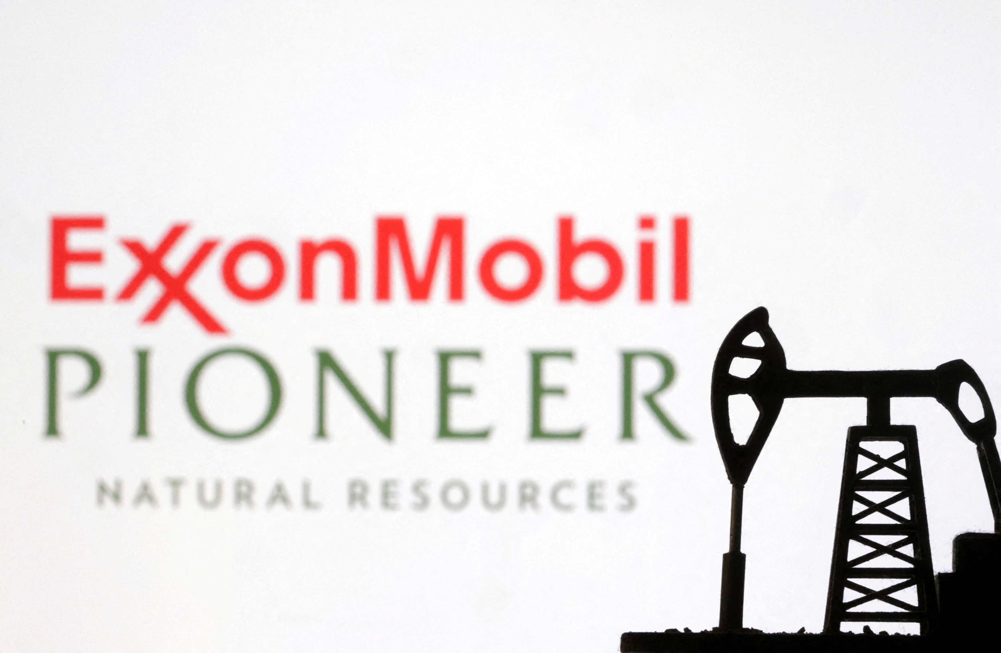 Illustration shows ExxonMobil and Pioneer Natural Resources logos