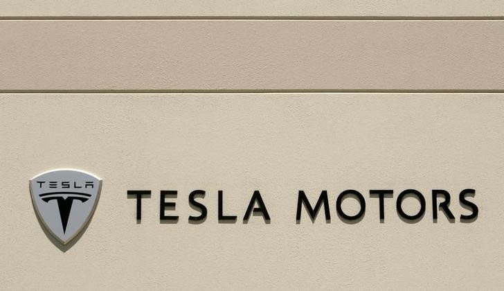 The logo for Tesla Motors is shown at the company headquarters in San Carlos
