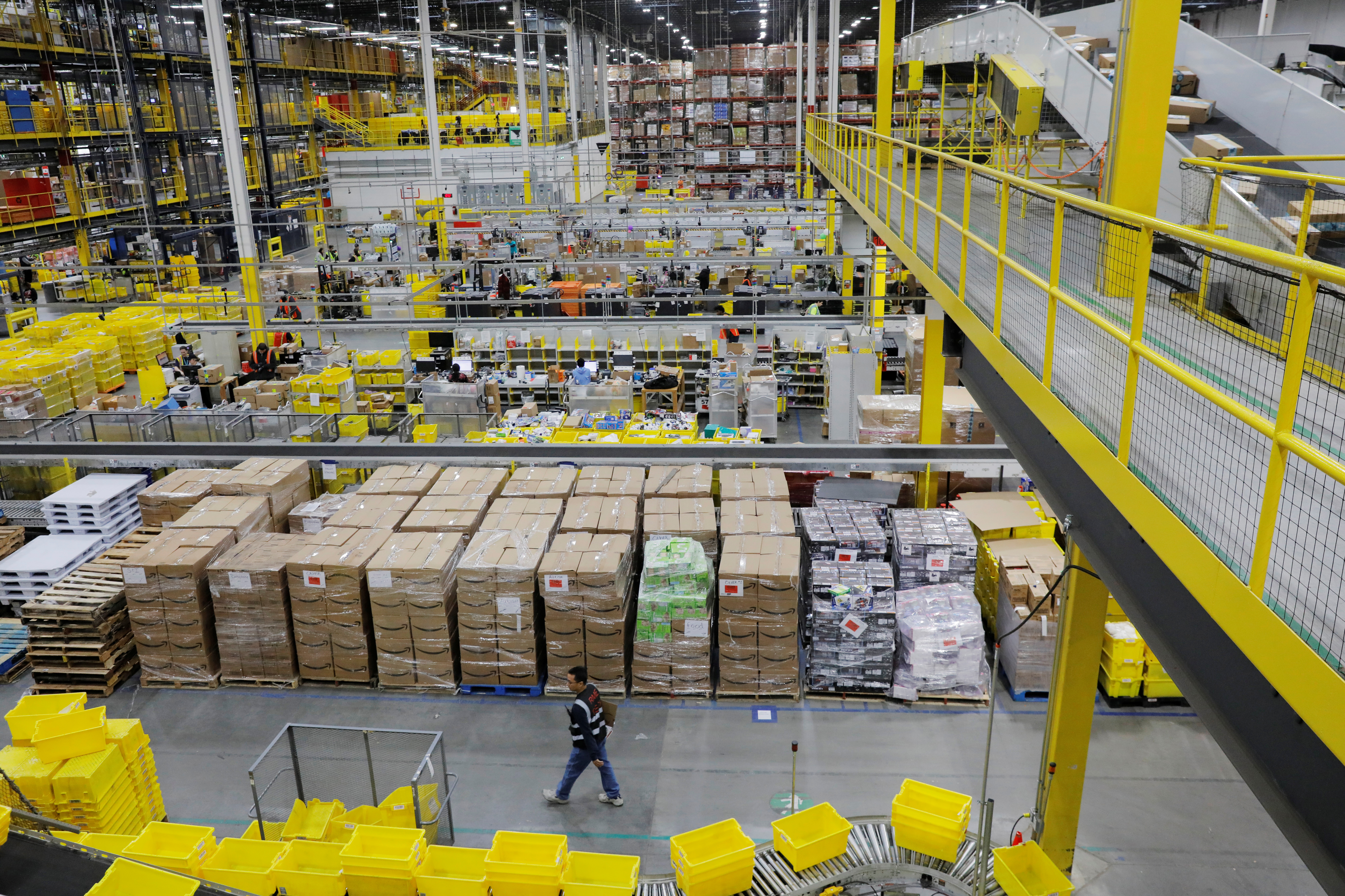 Amazon workers perform their jobs inside of an Amazon fulfillment center on Cyber Monday in Robbinsville, New Jersey, U.S., December 2, 2019.  REUTERS/Lucas Jackson