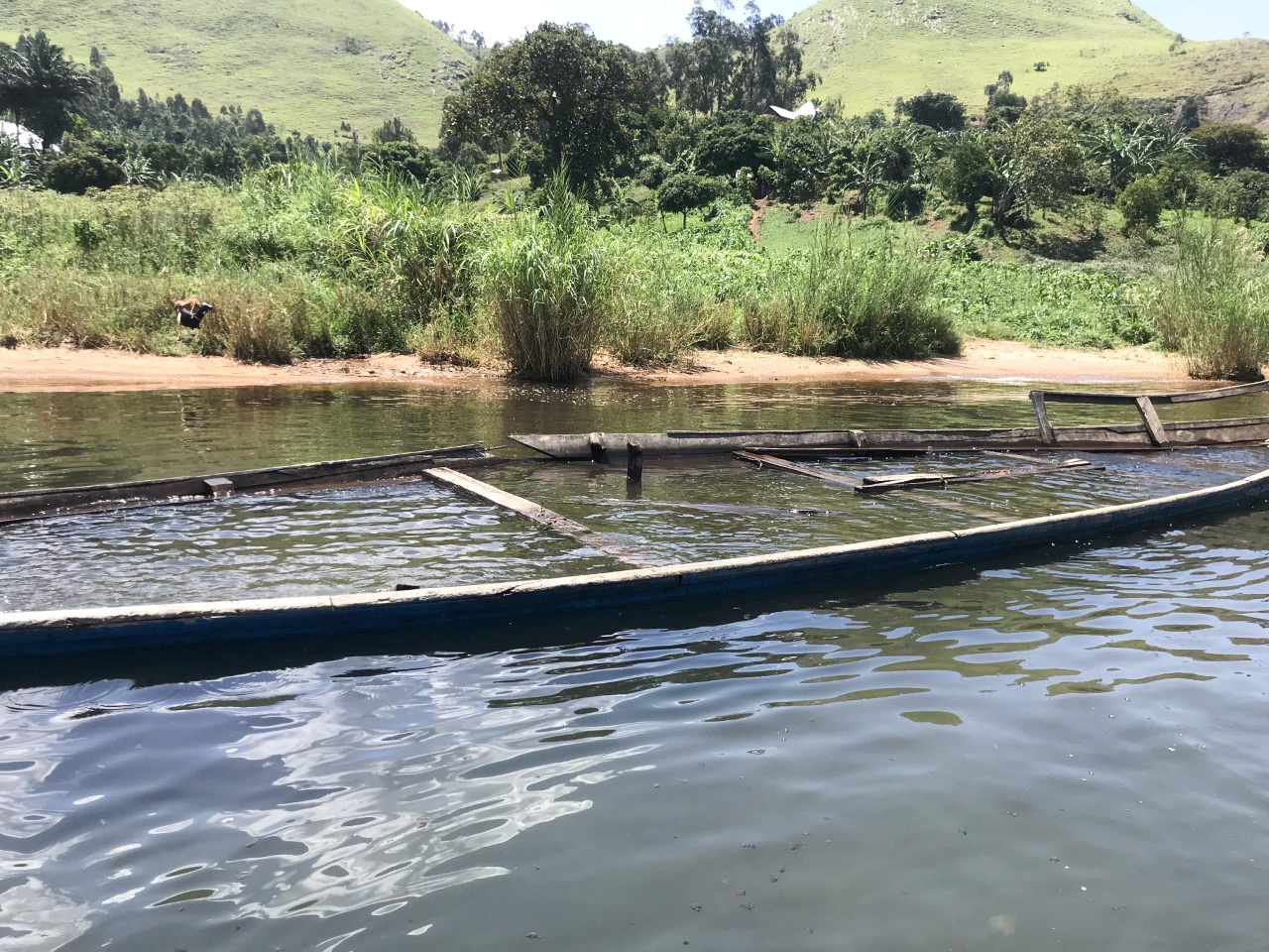 The remains of a passenger boat that capsized is seen floating in Lake Kivu near Nyatshibingu