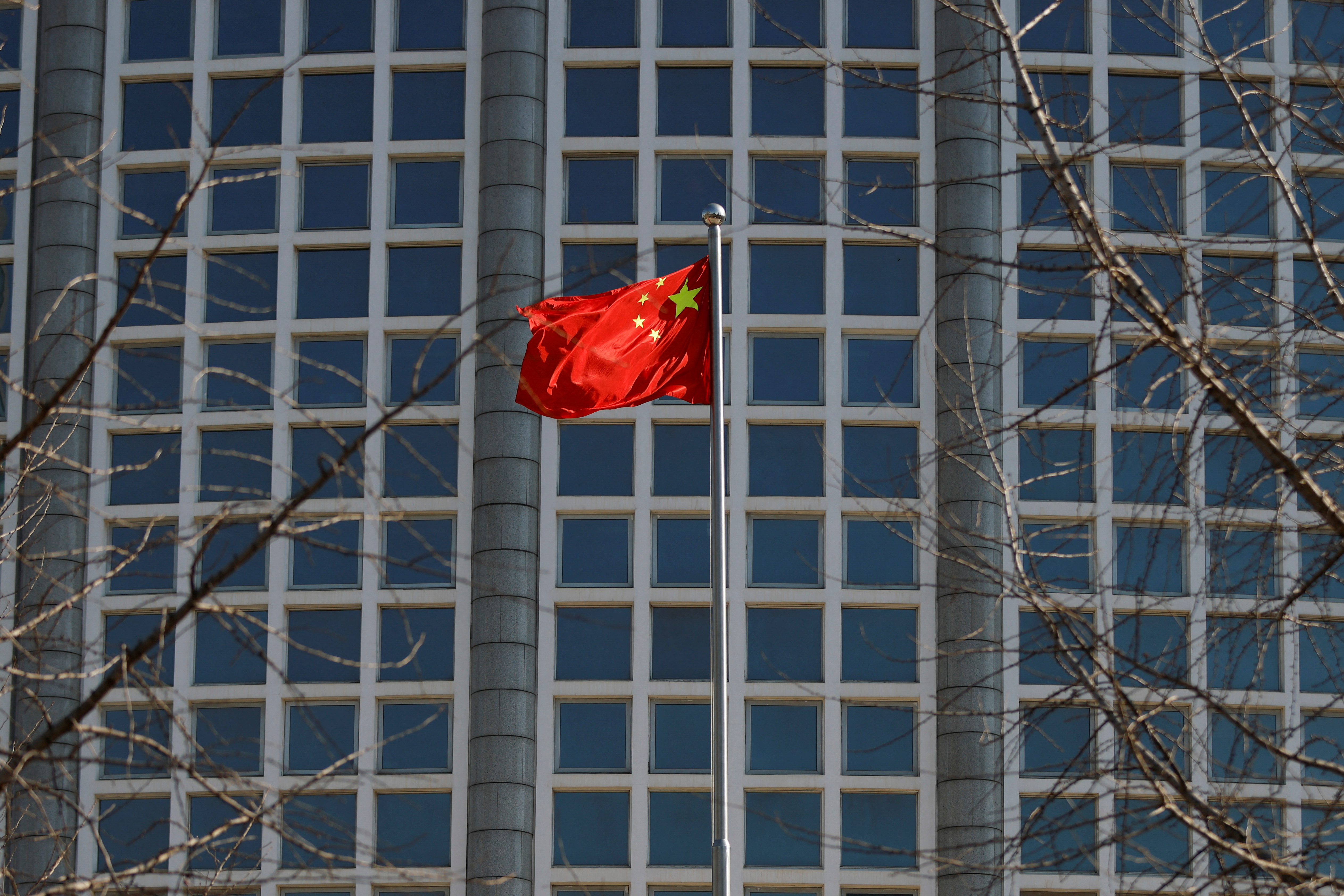 Chinese flag flutters outside the foreign ministry in Beijing