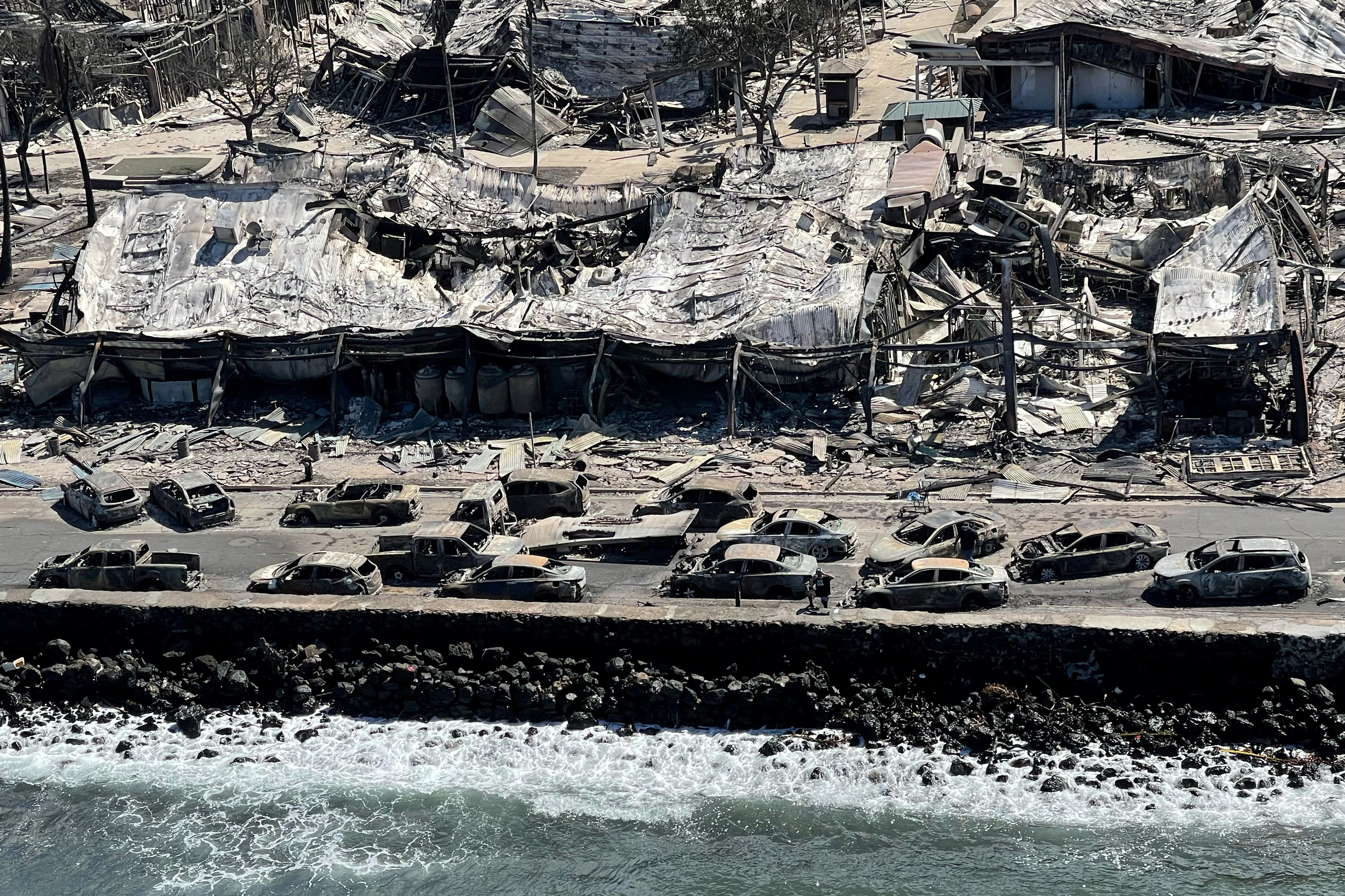 The shells of burned houses and buildings are left after wildfires in Lahaina